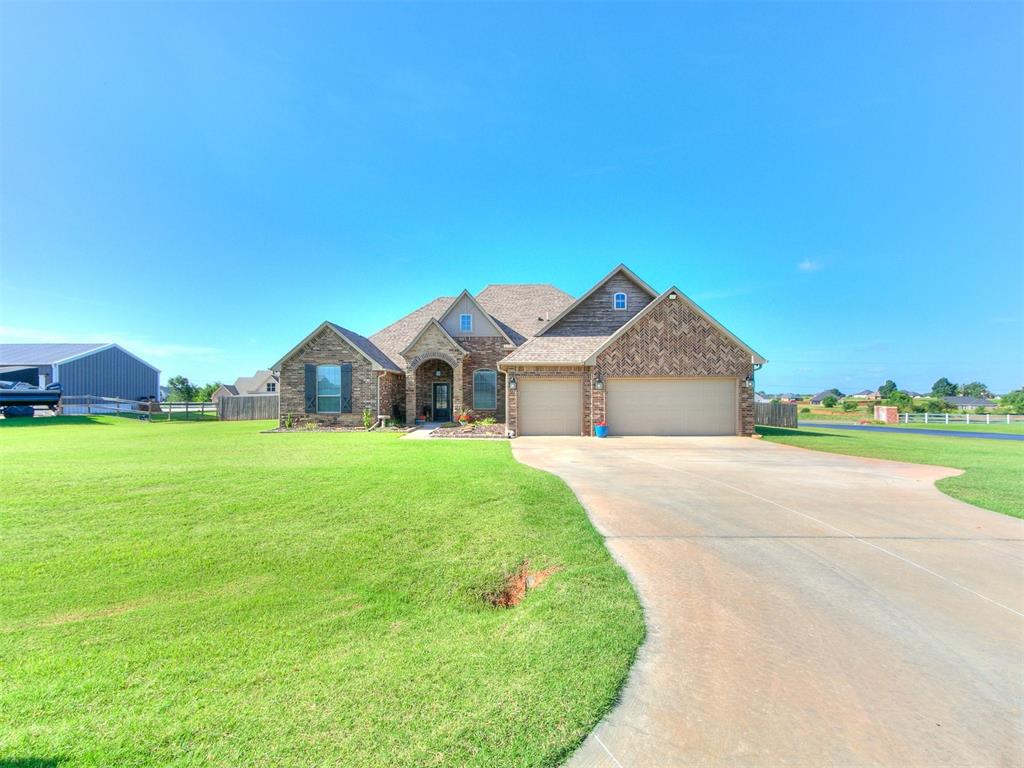 Located just outside city limits on nearly an acre in the quiet Summit neighborhood, this 4-bed, 3-bath home has a great layout and a long list of recent updates and features. New carpet runs throughout the entire home, and all countertops—including bathrooms—have granite. The kitchen is open to the living and dining area, with plenty of natural light. The secondary bedrooms are connected by a Jack-and-Jill bathroom, and there’s a dedicated mudroom with a separate laundry area. The primary suite includes a Jacuzzi tub, double vanities, and a walk-in closet. There's also a large, floored attic for extra storage. The backyard is fully enclosed with a picket fence, both the front and back yards have bricked flowerbeds with a sprinkler system and the back porch has an amazing view of the sunsets that only Oklahoma can create. There's also an above-ground pool for summer days. A full security system is already in place, with cameras on all four corners of the house and one inside the living room. This home is in the Deer Creek school district and offers a peaceful, country feel with easy access to amenities and city conveniences.