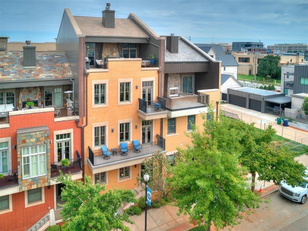Experience downtown luxury in this four-story, fully furnished concrete brownstone, complete with an upgraded elevator to all floors, a south-facing 4th-floor balcony, and an oversized 2-car garage. Inside, enjoy three fireplaces, 4-zone geothermal with Nest thermostats, high-end appliances, new windows, motorized blinds, and full smart-home features for effortless living. Just steps from coffee shops, a juice bar, restaurants, and close to the OKC Convention Center, Paycom Center, Scissortail Park, Bricktown, Automobile Alley, and Midtown. Tall ceilings, premium finishes, and stunning downtown views—including the Omni and First National—create an elevated, private feel. Built with brick over insulated BuildBlock, reinforced 8" concrete walls, and superior construction from floor to roof, this home offers vault-like durability, exceptional quiet, and energy efficiency—all with a low HOA unmatched by the competition.Property DOES come furnished/turn key ready!Less than a year lease options available!!Available for a short term month lease at rate of $10,000/mo.Full Service Lease with ALL utilities included.Security Deposit is equal to one month's rent$50 Application Fee Per Applicant(Approved Pets will add $50mo pet fee/per pet)Listing provided by Teddi Clanton, TAC Real Estate Services License #174342