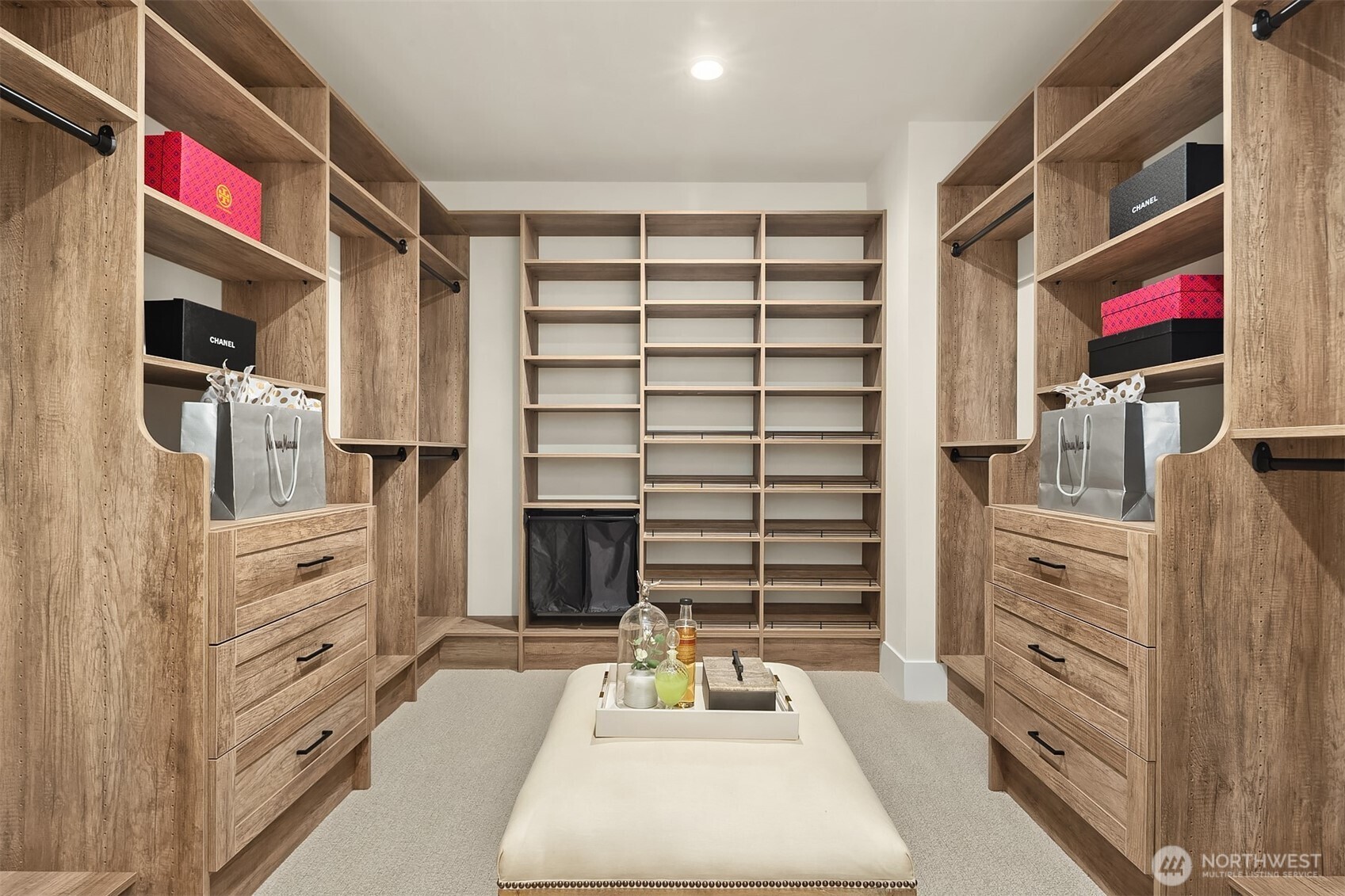 Custom-built walk-in closet with ample storage.