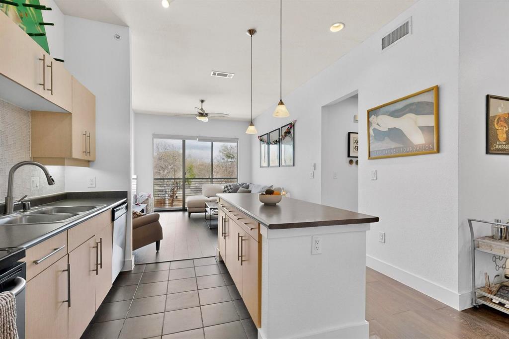 Courtyard-facing corner unit featuring automatic blinds & a highly private layout in an amazing Uptown Dallas location! As a top-floor end unit, this condo has no neighboring unit immediately beside or in front & does not align directly with the unit across the hall, providing an extra level of privacy AND quiet. A bright, welcoming floor plan opens to the kitchen & separate dining area, complete with a large kitchen island, pendant lighting & SS appliances. High ceilings & oversized windows allow for tons of great natural light throughout, plus a sliding door opening to a Juliet balcony in the living room, complete with automatic shades. The bathroom is extremely spacious & has multiple entries for easy access from the primary bedroom & main spaces, featuring dual sinks & a huge walk-in closet. Second bedroom could be used as an office, studio, workout space or guest room. Utility closet with full-size washer & dryer area can be closed off when not in use. Amenities in this gated community include covered parking, a saltwater pool, gym & dog run—the full package! Right down the street from Craddock Park, 5 minutes to Love Field airport & steps from the heart of Oak Lawn, Downtown Dallas, Arts District, Hospital District & West Village—you won't want to miss this fabulous condo in an unbeatable location.