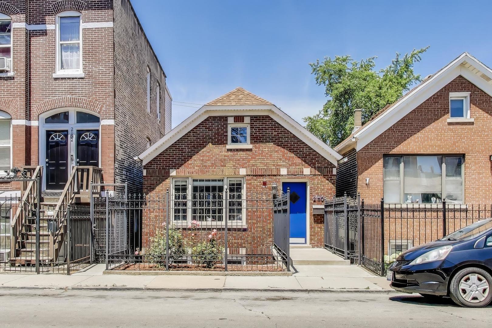 Beautifully renovated red brick single-family home with an open-concept layout drenched in natural sunlight. The interior boasts soaring ceilings, recessed lighting, and rich espresso-stained hardwood floors. Freshly painted throughout in stylish neutral gray tones with crisp white trim-this home is truly move-in ready.  The spacious kitchen features butcher-block countertops, stainless steel appliances, and overlooks both the living and dining areas-ideal for entertaining. The primary bedroom includes a walk-in closet with custom, floor-to-ceiling shelving.    A sun-soaked rear sunroom offers the perfect space for a home office or work-from-home setup. The attached brick garage leads directly into a convenient mudroom and down to a full basement with a dedicated laundry area and a modernized central HVAC system.