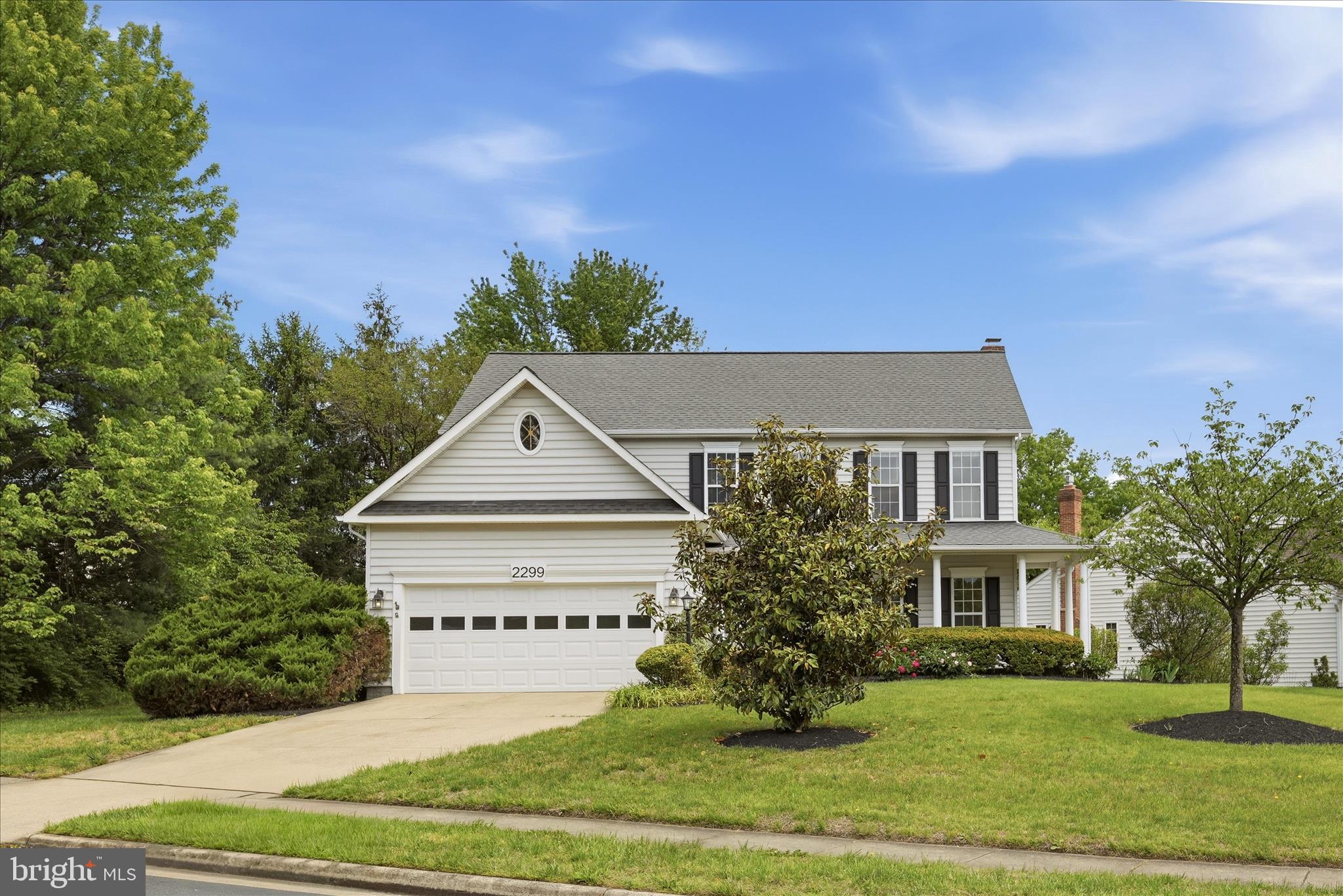 Welcome home to this charming Madison model, beautifully situated on a desirable .40-acre lot in the sought-after Polo Fields neighborhood. With a classic covered front porch, custom brick walkway, 2-car garage, mature landscaping, and a private backyard setting, this home offers wonderful curb appeal, space, and convenience—all just approximately 1/2 mile from the Silver Line Metro.Inside, the home feels bright, spacious, and inviting, with a traditional layout that works well for both everyday living and entertaining. The main level features formal living and dining rooms with elegant trim details, hardwood flooring, and abundant natural light. The kitchen includes oak cabinetry, granite countertops, a center island, stainless steel appliances, recessed lighting, a large pantry, and a convenient coffee bar area. The kitchen opens to the breakfast area and family room, where a wood-burning fireplace creates a comfortable gathering space.Outdoor living is a true highlight, with a large composite deck overlooking the private backyard and common space beyond. The brick patio below provides an additional area for relaxing, grilling, or entertaining, while the wide lot and mature trees create a peaceful setting rarely found so close to major commuter routes and Metro access.Upstairs, the spacious primary suite includes a large bedroom, sitting area, two walk-in closets, and a luxury bath with dual vanities, soaking tub, and separate shower. Three additional generously sized bedrooms share a large hall bath, offering excellent flexibility for family, guests, or home office space.The finished lower level expands the living area with a large recreation room, full bathroom, and additional unfinished storage space. Whether used for movie nights, a playroom, fitness area, guest space, or hobbies, this level adds valuable versatility.Recent updates include the roof and HVAC, both approximately 10 years old. With its rare combination of lot size, garage parking, finished living space, outdoor entertaining areas, and proximity to Metro, this is an exceptional opportunity in one of Reston’s most convenient neighborhood settings.