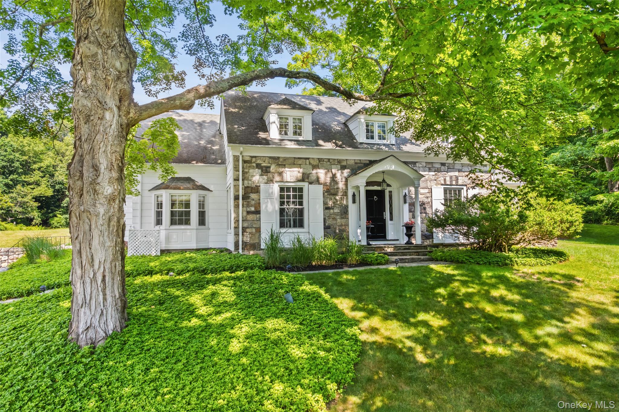 Gracious Country Colonial!  Originally built in 1932 and thoughtfully renovated, this timeless antique Colonial seamlessly blends historic character with modern updates. Offering approximately 2,800 square feet of beautifully appointed living space, the home features hardwood floors, period millwork, abundant natural light, French doors, and nicely proportioned rooms throughout. Former owner Liz Lange engaged noted designer Jonathan Adler to appoint the interior.  The chef's kitchen features all Viking appliances, custom cabinetry, marble countertops, a center island with breakfast bar, and provides easy access to the outdoor terrace—ideal for everyday living and entertaining. Expansive, level lawns lead to hidden walking trails at the rear of the property, while a private in-ground pool and cabana create a peaceful outdoor retreat.  This home is brimming with charm and distinctive character throughout.  Additional highlights include a formal dining room, an elegant living room with a fireplace and custom built-ins, a sweet sunroom, and a versatile den/home office. The second-floor features three beautifully appointed bedrooms, an additional office, and a spacious primary suite with an ensuite bath.  Professionally landscaped grounds enhance the property's setting, offering a peaceful and picturesque backdrop. Conveniently located just minutes from the Villages of Katonah and Ridgefield, with easy access to major commuting arteries.   This home is located within the award-winning Katonah-Lewisboro School District.   This is one you won't want to miss!