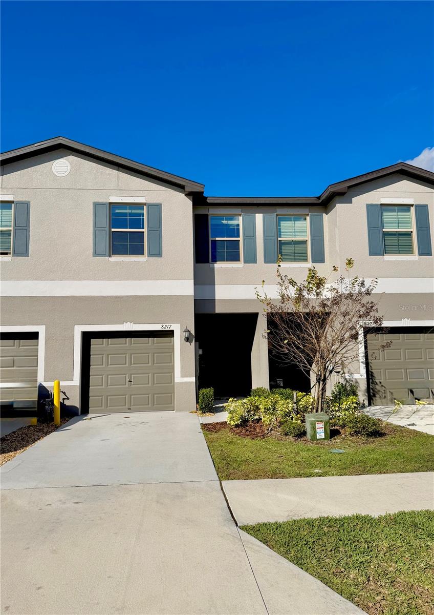 One or more photo(s) has been virtually staged. WELCOME TO BRYANT SQUARE TOWNHOMES IN THE HEART OF THE TRINITY AREA.  Over 1,600 square feet of thoughtfully designed living space, this move-in-ready townhome offers 3 bedrooms, 2.5 baths, and a 1-car garage. The open-concept main level features a spacious great room with dining and kitchen overlooking the living area, perfect for everyday living and entertaining. A screened-in rear porch extends your living space outdoors. Upstairs, a versatile loft provides the ideal study or flex area, along with a generously sized primary suite featuring a private en-suite bath and walk-in closet.Built by Lennar in 2024, this nearly brand-new home includes modern upgrades such as a tankless water heater, natural gas, and hurricane shutters. Enjoy low-maintenance living in a vibrant community featuring a cabana-style pool within walking distance, paved walking and biking trails, two community clubhouse pools, and a playground. Conveniently located less than a mile from Mitchell Plaza with restaurants, shopping, and top-rated schools, plus easy access to the Starkey Connector Trails and Suncoast Trail. This home offers the perfect blend of comfort, convenience, and community—a must-see!