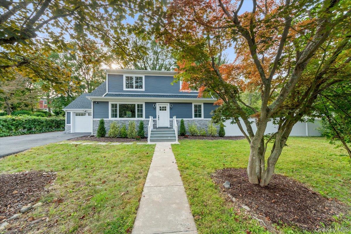 This Valhalla schools five bedroom four bath beauty will check all your dream home boxes! Let the gorgeous landscape and curb appeal pull you in. Entire home fully remodeled 2022 with new kitchen, baths, appliances, heating and cooling system, roof, windows, siding, electric, plumbing, and more! Beautiful extra wide front stairs and door way lead to lovely open layout.  1st floor with open island kitchen, sunny living room and dining area. Take the hallway to first full bath and two beautiful main level bedrooms. Second floor includes master bedroom with spacious master bath, two more sunny bedrooms, and another beautiful full bathroom. Lower level boast two bonus rooms, storage, utilities, laundry room, and walk out to yard. Expansive back yard has a deck and the rest is a beautiful outdoor oasis to be designed to your liking. Fully fenced with doors to the left and right of the home. One car garage with plug for electric vehicles, five car driveway, Tankless water heater, security system. 3 min drive or 14 min walk to north white plains train station.  Easy Access to Multiple Parkways. 33 min. train to NYC, Walk or Drive to Kensico Dam Plaza, enjoy beautiful bike trails and outstanding year-round events including July 4th Fireworks and Winter Wonderland! STAR Savings not included. Upgrades done to address flood zone- 3 sump pumps and dry well added (4 sump pumps total)  French drainage system installed with 15 year guarantee -invoice attached. Make an appointment to view today!