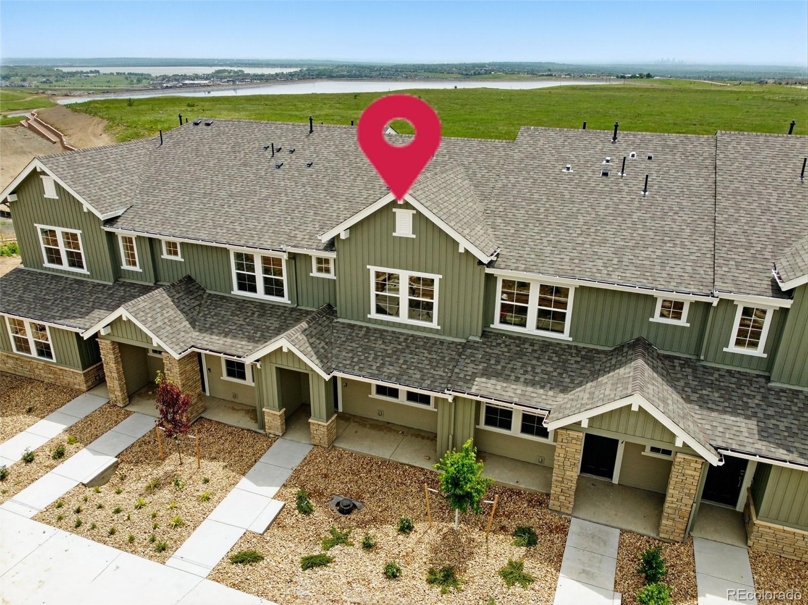 New Construction - Ready Now! Built by America's Most Trusted Homebuilder. Welcome to the Backcountry at 17123 W 91st Lane in Trailstone Townhomes Westerly Collection! This modern townhome features an open main floor with a connected kitchen featuring quartz countertops, dining, and gathering area. Upstairs, enjoy a spacious primary suite with a sitting room, walk-in closet, and en-suite, plus a secondary bedroom with its own en-suite and a convenient laundry room. Located in Trailstone, surrounded by breathtaking views and open space, the community offers top-rated Jefferson County Schools, quick access to major highways, light rail, and nearby cities like Denver, Boulder, and Golden. Future amenities include a pool, pickleball courts, amphitheater, and miles of scenic trails, with parks, a dog park, and shopping just minutes away. Trailstone blends comfort, convenience, and Colorado beauty. Additional Highlights Include: Raise vanity at secondary bath. MLS#2654432