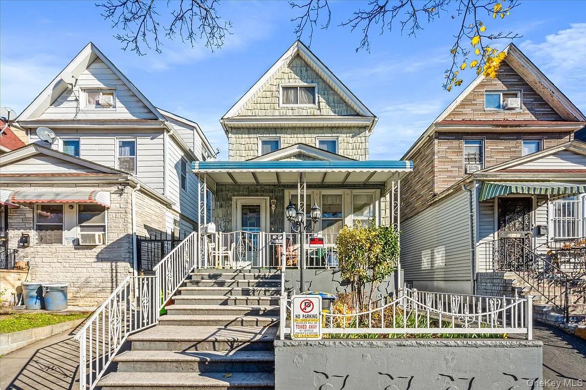 Welcome to this exceptionally well-maintained single-family home in the heart of Jackson Heights, ideally located just off 37th Avenue—one of the neighborhood’s most vibrant corridors, surrounded by top-rated restaurants, shopping, parks, and convenient access to trains and buses. This spacious home offers a versatile multi-level layout with approximately 1,963 sq ft of interior space. The main floor features a bright and inviting living room, a formal dining room perfect for entertaining, and a generously sized eat-in kitchen with direct access to the backyard. A screened-in porch adds additional charm and a perfect space to relax. Upstairs, the second floor offers three well-proportioned bedrooms, including a primary bedroom, along with a full bathroom. The third floor provides two additional rooms and a large hall space—ideal for extended living, guest quarters, a home office, or creative use. The finished basement adds even more functional space, featuring a large recreation area perfect for entertaining, storage, or flexible living arrangements. This property is complete with a private driveway and garage, a rare and highly desirable feature in Jackson Heights. A true opportunity to own a spacious, move-in-ready home in an unbeatable location with room to grow, customize, and make your own.
