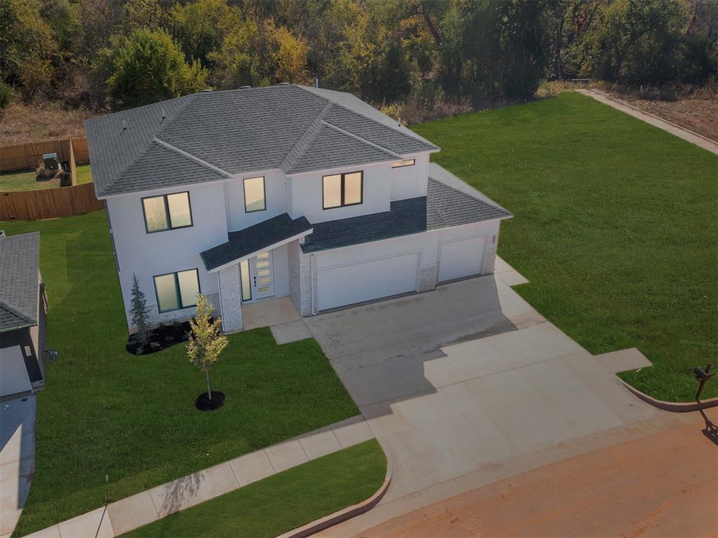 LIMITED INCENTIVE - Ask for details. Imagine the life you can live here in Echo Park, a Deer Creek Community at this new home - 5608 NW 154th Terrace!. Thanks to the open living area, you can easily have people over, serving snacks from the kitchen while your friends gather around the game on TV. The linear gas fireplace adds a touch of contemporary elegance. The kitchen is amazing with enough room for even the most advanced chef, and is the heart of this home! Featuring stunning cabinetry, walk-in pantry, under cabinet lighting, and stainless appliances including double ovens, refrigerator, and a gas range. Then, when evening comes, you can retreat to your spacious primary suite and relax in style in this amazing spa bathroom. Separate vanities, freestanding tub, shower with frameless glass shower enclosure, and a mirror in the closet. Double doors leading to the perfect home office/study off entry. Located upstairs are the secondary bedrooms, bathroom, and living area. Tile flooring in main living areas, dining & study. Sink in the utility room for your convenience. You will thoroughly enjoy your outdoor space with a covered patio. Additional Features: Soft close hardware on all cabinets, Fence with one gate, white blinds, zoned irrigated sprinkler system, tankless water tank, and post-tension engineered foundation provide peace of mind. Don't miss this outstanding home in Deer Creek's New neighborhood! Echo Park will soon have exciting amenities residents can enjoy on-site. Coming soon amenities include a playground, basketball court, swimming pool, & clubhouse. Neighbors can look forward to making fun memories, relaxing, and unwinding with these new amenities. Parents who live in Echo Park can send their kids to school at the renowned Deer Creek School District. Photos provide great staging ideas.  Welcome Home.