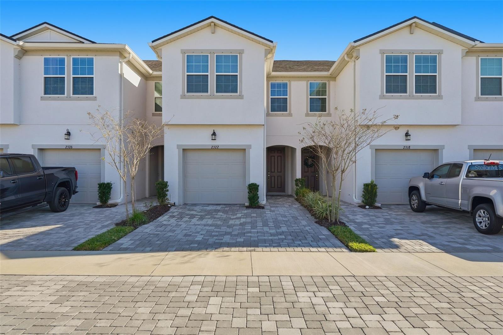 This beautifully designed Marianna townhome offers 1,667 square feet of well-planned living space with an open and spacious layout ideal for modern living. Featuring a West Indies–inspired exterior, the home delivers strong curb appeal with a clean, coastal aesthetic.Inside, the home is finished with L2 Frost White quartz countertops throughout, perfectly complementing the upgraded Level 3 Tahoe painted Harbor cabinetry. The main living area on the first floor is finished with Level 1 17x17 ceramic tile in a 50x50 brickset pattern, providing both durability and style.The floor plan includes three bedrooms, two and a half bathrooms, and a single-car garage, along with ample storage throughout. A two-car-wide paver driveway offers additional guest or secondary parking. The screened and pavered lanai creates an inviting outdoor living space with peaceful views.Upstairs, a versatile second-floor loft provides flexible space suitable for a home office, media area, or additional living space. All bedrooms feature generous closet storage, while the owner’s suite includes multiple closets and a spacious walk-in closet.Additional highlights include a walk-in pantry, an oversized one-car garage, and an included Smart Home Technology package, adding both convenience and efficiency to this well-appointed townhome.