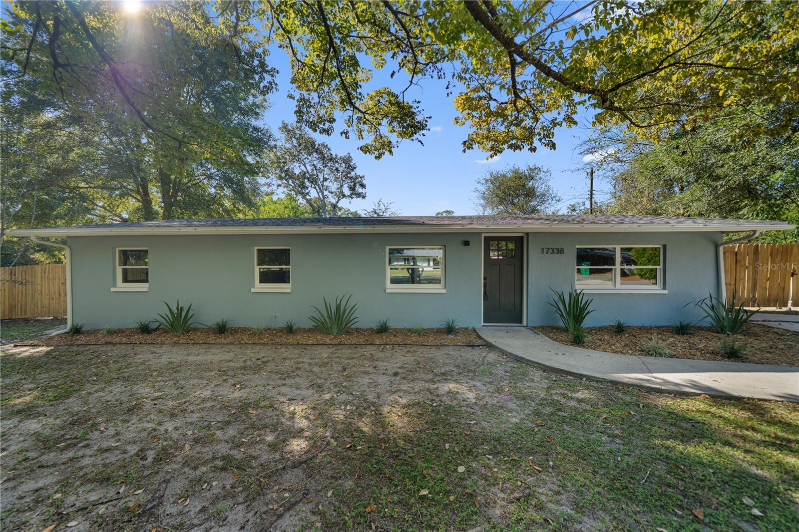 Welcome home to the most affordable, fully renovated 4 bedroom 2 bath home in town! As you enter the living space you’ll immediately notice the professional designer touches such as the clean & bright paint & warm floors that are continuous throughout the home. The kitchen is filled w/ natural light & features brand new appliances, soft-close cabinets, butcher block counters & a tasteful backsplash. The concrete block exterior, new roof & no carpet means low maintenance for years to come. Other recent updates include new energy efficient windows, bathrooms, luxury vinyl plank flooring (no carpet), fixtures & a fully fenced-in backyard. The large 1/4 acre lot has great mix of mature landscaping, fruit trees, a storage shed & still has plenty of space to run & play or lounge & enjoy the crips fall days. There’s room store a boat, RV or tiny home on the side w/ the double gate entrance. All this & more a few minutes drive to the crystal clear freshwater springs, rivers, hiking trails & campgrounds, or charming historic downtown full of dining, shopping & parks. Washer & dryer are included there’s nothing left to do other than move in; come see all this home has to offer today!