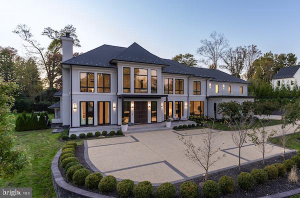 Step into an extraordinary world of luxury and design in this spectacular 17,135-square-foot estate, offering 7 bedrooms, 7 full baths, and 5 half baths. Every inch of this residence is a masterclass in elegance, sophistication, and effortless functionality. From the moment you enter the grand foyer, you're welcomed into an open, flowing floor plan designed for both grand entertaining and intimate everyday living. The expansive family room seamlessly connects to a refined home office, a serene sitting room, and a showstopping chef’s kitchen featuring SieMatic cabinetry — a top German brand — and outfitted with Gaggenau, Sub-Zero, and Wolf appliances, the absolute pinnacle of culinary excellence. An adjoining catering kitchen makes hosting large gatherings effortless, while a main-floor bedroom and chic mudroom add everyday convenience with sophisticated style. Elegant dual staircases and a private elevator offer seamless access to every level, blending form and function in perfect harmony. Designed by renowned interior designer Skip Sroka, every detail of this estate is meticulously curated, from the stunning architectural elements to the exclusive designer light fixtures gracing every room. Integrated speakers are thoughtfully built into the walls and positioned under the TVs, allowing for different sound zones throughout the home. Outdoor speakers by the pool extend the experience, ensuring every gathering — indoors or out — is elevated by impeccable ambiance. The private primary suite is a true retreat, offering a cozy sitting area, a roaring fireplace, and a covered deck for relaxing mornings or starry nights. Dual oversized closets and a spa-inspired bath — complete with a luxurious steam shower and dual water closets — elevate the suite to a true sanctuary. Four additional ensuite bedrooms ensure that family and guests are treated to unparalleled comfort and privacy. Six stunning fireplaces are woven throughout the home, creating warmth and ambiance at every turn, while multiple washer/dryer sets on different levels offer unmatched everyday convenience. The lower level is pure indulgence — featuring a private sauna/steam room, a state-of-the-art theater room, a fully equipped gym, a vibrant bar, and a spacious recreation room perfect for entertaining. An additional ensuite bedroom on this level adds even more flexibility for hosting guests. The technology throughout the home is equally impressive, including a Savant TV system and Sonos for music, offering a seamless, top-tier audiovisual experience. Recent enhancements include a new fence and gate, as well as motorized blinds and curtains for added privacy and convenience. A full water softener system further elevates the everyday living experience with refined comfort. Outside, the resort-style pool area is a private paradise, meticulously designed for luxurious relaxation and entertaining. Whether you're lounging poolside, dining al fresco, or gathering under the sun with music floating from the outdoor speakers, this outdoor retreat elevates every moment. Every element of this extraordinary home reflects world-class craftsmanship, timeless design, and thoughtful innovation, creating a residence that feels at once grand, welcoming, and unforgettable.