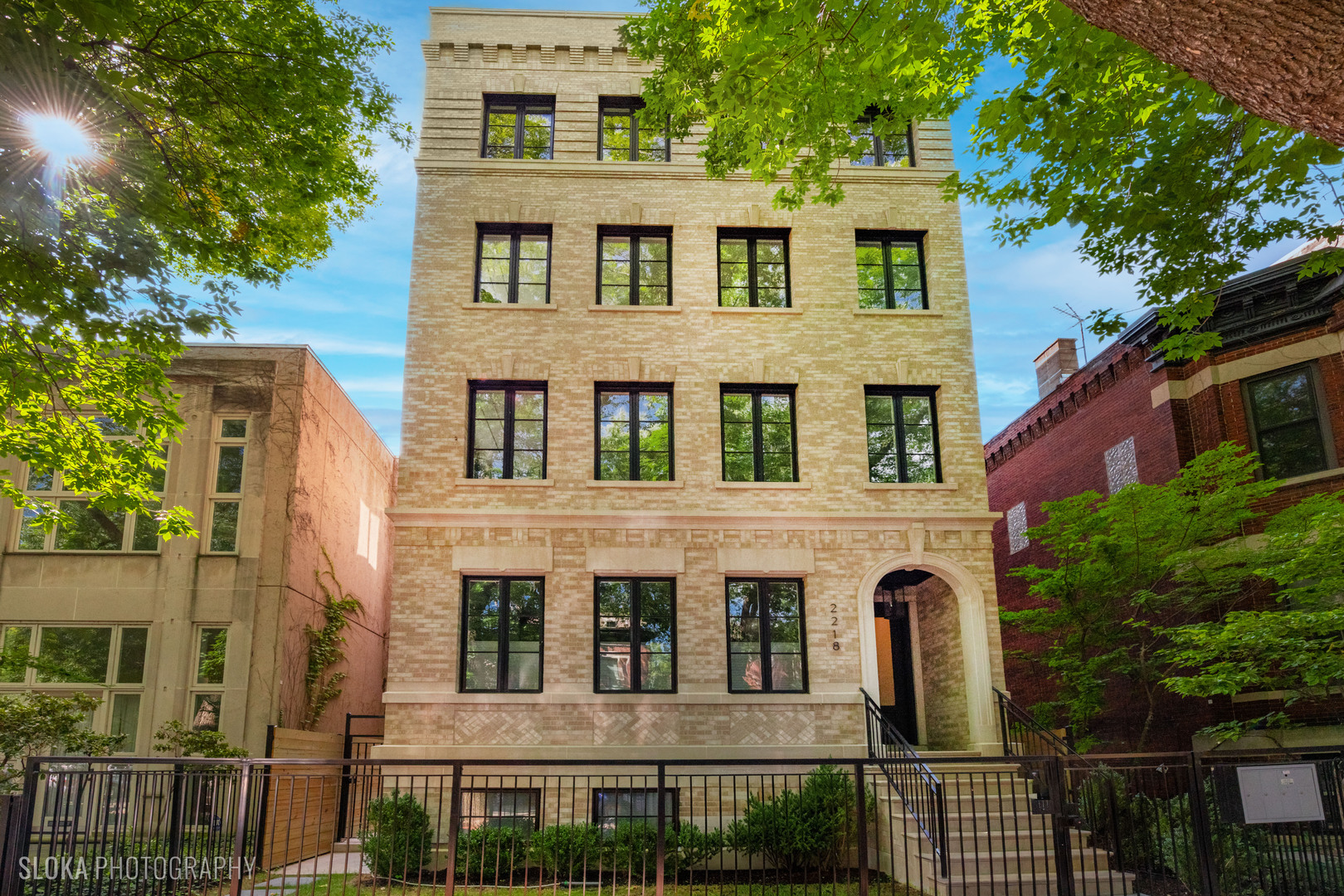 Stunning Lincoln Park Penthouse - A True Urban Oasis! Finished and ready for occupancy. Discover the epitome of luxury living in this magnificent penthouse located on one of Lincoln Park's most sought-after tree-lined streets, just steps from Oz Park. Set on a rarely available 32' wide lot, this property boasts a beautifully detailed facade of classic limestone and brick.   Designed and built by a renowned builder, every inch of this incredible penthouse has been meticulously planned and executed. The main level features two expansive living and entertaining areas, perfect for hosting lavish gatherings or comfortable everyday living. A private office offers a quiet retreat, while a custom bar anchors the stylish kitchen and living/dining/playroom.    The gourmet kitchen is a chef's dream, featuring trendy custom millwork and luxurious natural stone quartzite countertops. Elegant limestone and quartzite fireplace mantels add warmth and sophistication to the living spaces. With an enormous primary suite complete with a walk-in closet and a luxurious spa-like bathroom, this home redefines comfort and elegance. Each bedroom includes its own en-suite bathroom, ensuring privacy and convenience for every resident.The timeless paneling and remarkable attention to detail exude quality at every turn. Enjoy stunning downtown views from several windows, adding a vibrant city backdrop to your everyday life.    Step outside to the expansive rooftop, which spans the entire floor and is outfitted with a wet bar-ideal for entertaining while taking in sweeping views of the Chicago skyline, especially during the unforgettable summer days.This penthouse truly has no rival, combining luxurious living with an unbeatable location in the heart of Lincoln Park. Don't miss your chance to call this extraordinary property home!