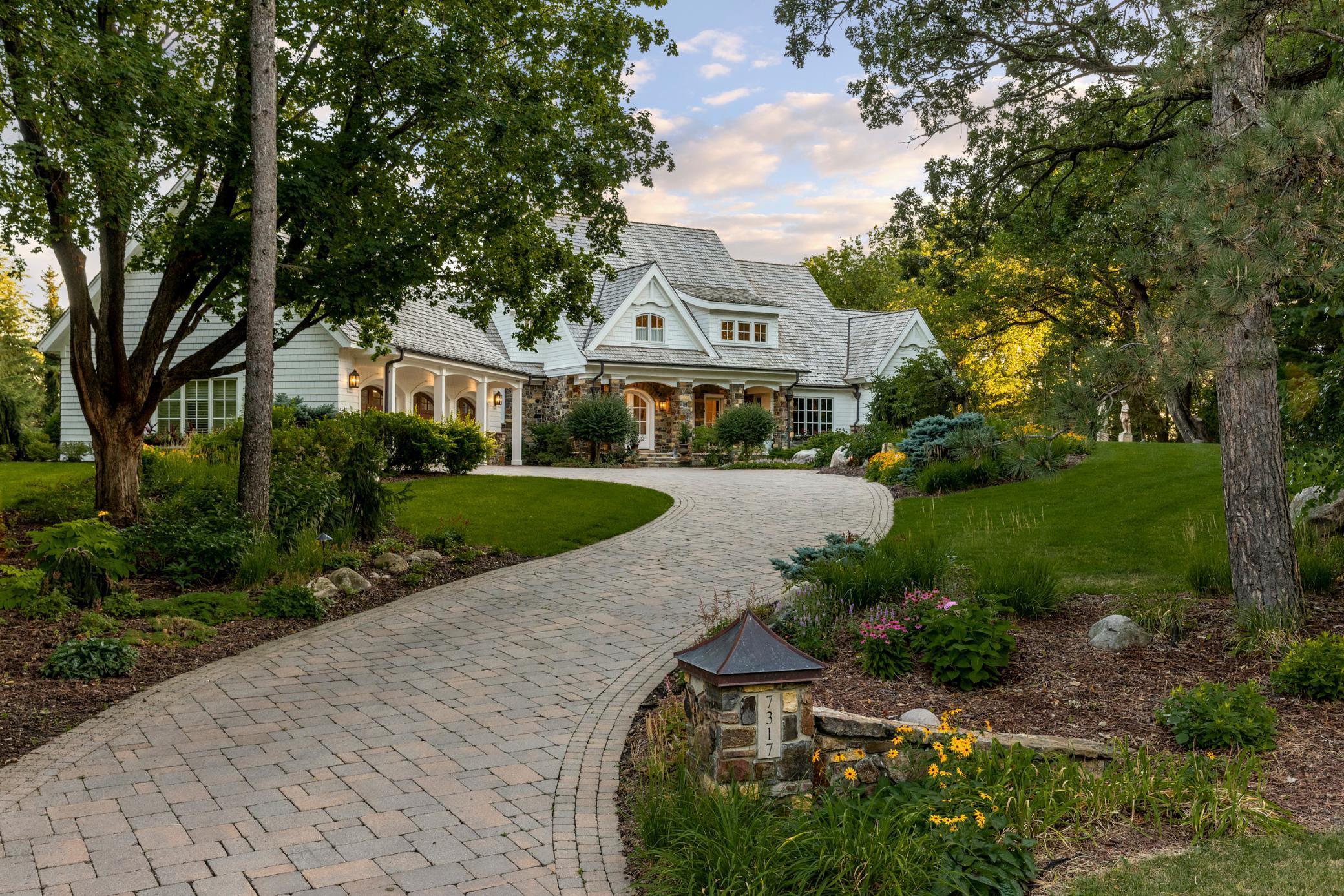 Charles Cudd 2008, remodeled by West Bay Homes 2021. 3,51 acres of Private Panoramic Woodland Views of the MN River Valley w/ trail system abound. Long paver drive. Stately home reveals airy 10 FT ceilings, walls of Windows/French Doors, walnut wood floors, impressive millwork/beams. Vaulted 18 FT GR ceiling. Designer lighting mingles w/ natural light & Refined Architectural Details. Saltwater infinity pool hot tub reflection pool & lawns/gardens. Pool bath, 3 gas fireplaces, one in the Spacious Main Level BR suite w/ heated tile bathroom floors. Wood burning FP in the Vaulted Sunroom. Outdoor gas fire pit & gas grill rest on limestone multi level outdoor entertainment decks. Fully remodeled custom kitchen w/ rear prep pantry kitchen subzero/wolf+ 2 sinks 2 dishwashers. Walk Out LL has heated floors 3 suites+ 1/2 bath, stone wet bar, multi level theater, office & gym. oversized Heated 3 car Garage. Whole Home Audio/Security. Proof of funds prior to any showings respectfully.