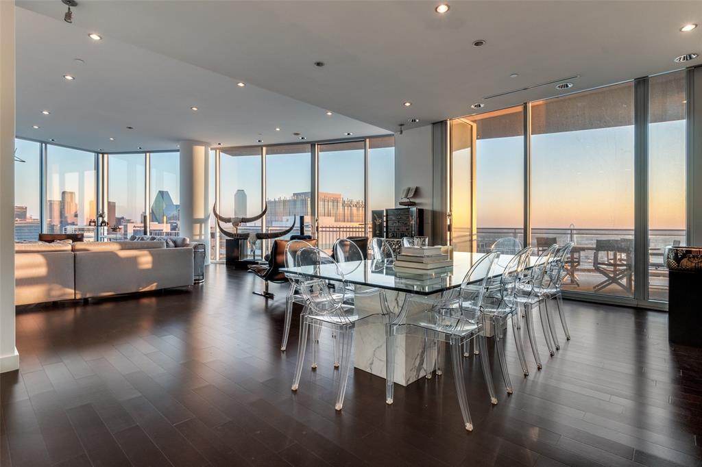 Perched on the 27th floor of the iconic Azure Condominium, this exceptional sub penthouse residence offers sweeping views of the Dallas skyline and an elevated luxury lifestyle in the heart of the city. Thoughtfully transformed from the sought-after 01 floorplan, the residence features a sophisticated, open-concept design with floor-to-ceiling windows that showcase breathtaking city views and fill the home with natural light.The chef-inspired kitchen is appointed with premium Sub-Zero appliances, a built-in coffee system, and a Sub-Zero wine refrigerator, creating a space designed equally for everyday living and effortless entertaining. Refined finishes, spacious living areas, and meticulous attention to detail throughout reflect the caliber of this remarkable home.Residents of Azure enjoy an unparalleled collection of amenities, including resort-style pools, fitness facilities, concierge services, and beautifully appointed common spaces. Adding an exceptional level of convenience and rarity, this residence includes a four-car private garage—an extraordinary offering for luxury high-rise living.Experience elevated Dallas living with panoramic skyline views, exceptional amenities, and the privacy and convenience of a four-car garage, all from one of the city’s most desirable high-rise addresses.