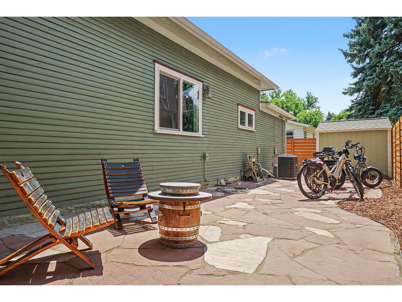 Some homes offer a place to live-703 W. Mountain Ave. offers a way of life. Located on one of Old Town Fort Collins' most iconic tree-lined streets, this beautifully restored 1898 home places you just six blocks from the heart of Old Town, where locally owned restaurants, boutiques, breweries, live music, festivals, City Park, and entertainment create the vibrant lifestyle that makes Fort Collins so special. Spend mornings with coffee on the welcoming front porch, evenings visiting with neighbors, and summer weekends watching the historic trolley pass by. This is the charm, connection, bike-and-walkability that define Old Town living. Thoughtfully updated while preserving its historic character, this 2,205-sq.foot home offers 1665 sq feet of finished space on the main level, including 3 bedrooms (one nonconforming) and 2 baths, plus additional unfinished basement space. The original hardwood floors blend beautifully with new LVP, while the renovated kitchen features new stainless steel appliances, walnut countertops, refinished cabinetry, and updated fixtures. Modern lighting, new ceiling fans, gorgeous step-in shower and a clean, timeless design complement the home's original craftsmanship without sacrificing its soul. Extensive improvements completed in 2024 & 2025 provide comfort and peace of mind, including a brand-new furnace and central air conditioning. Exceptional curb appeal welcomes you home with a spacious front porch, lush front yard, classic white picket fence, & a private flagstone side patio-perfect for relaxing or entertaining. Every detail reflects the care invested in this special property. Opportunities to own a thoughtfully updated historic home on West Mountain Avenue are rare. This is more than a beautiful home-it's an invitation to become part of one of Fort Collins' most cherished neighborhoods and enjoy the timeless character, community, and lifestyle that make Old Town unlike anywhere else.