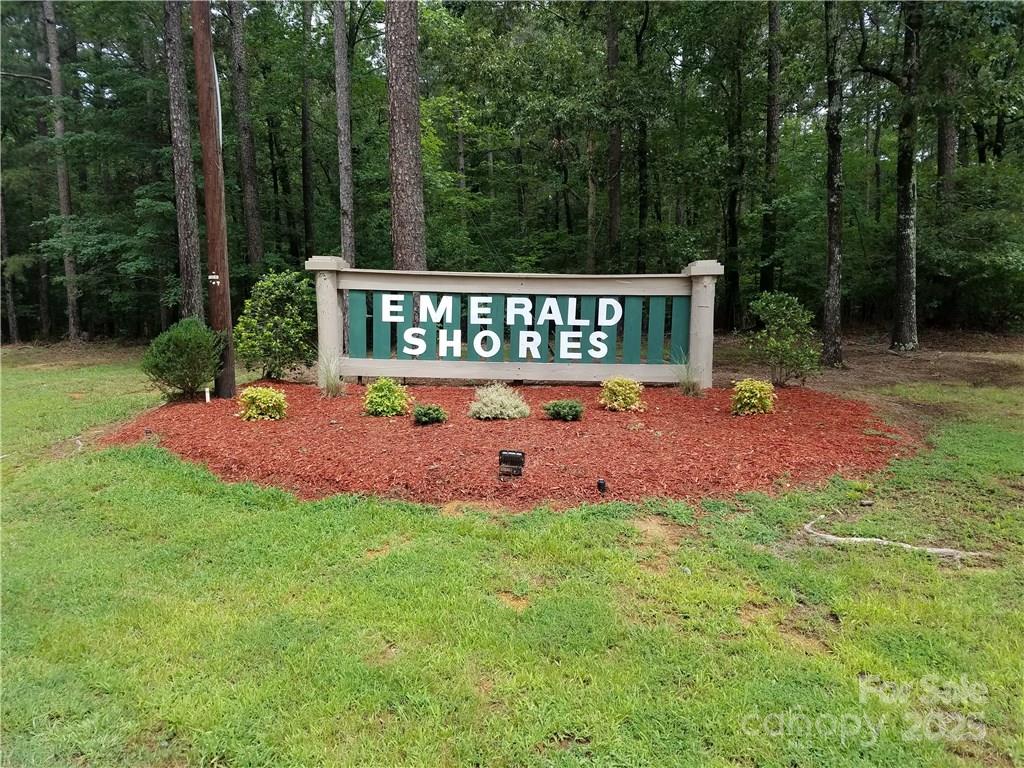 Beautiful Waterfront Lot in Emerald Shores on Lake Tillery.  

Buyers should apply for a pier permit with Duke Energy to confirm the ability to build a boat house as part of their due diligence.