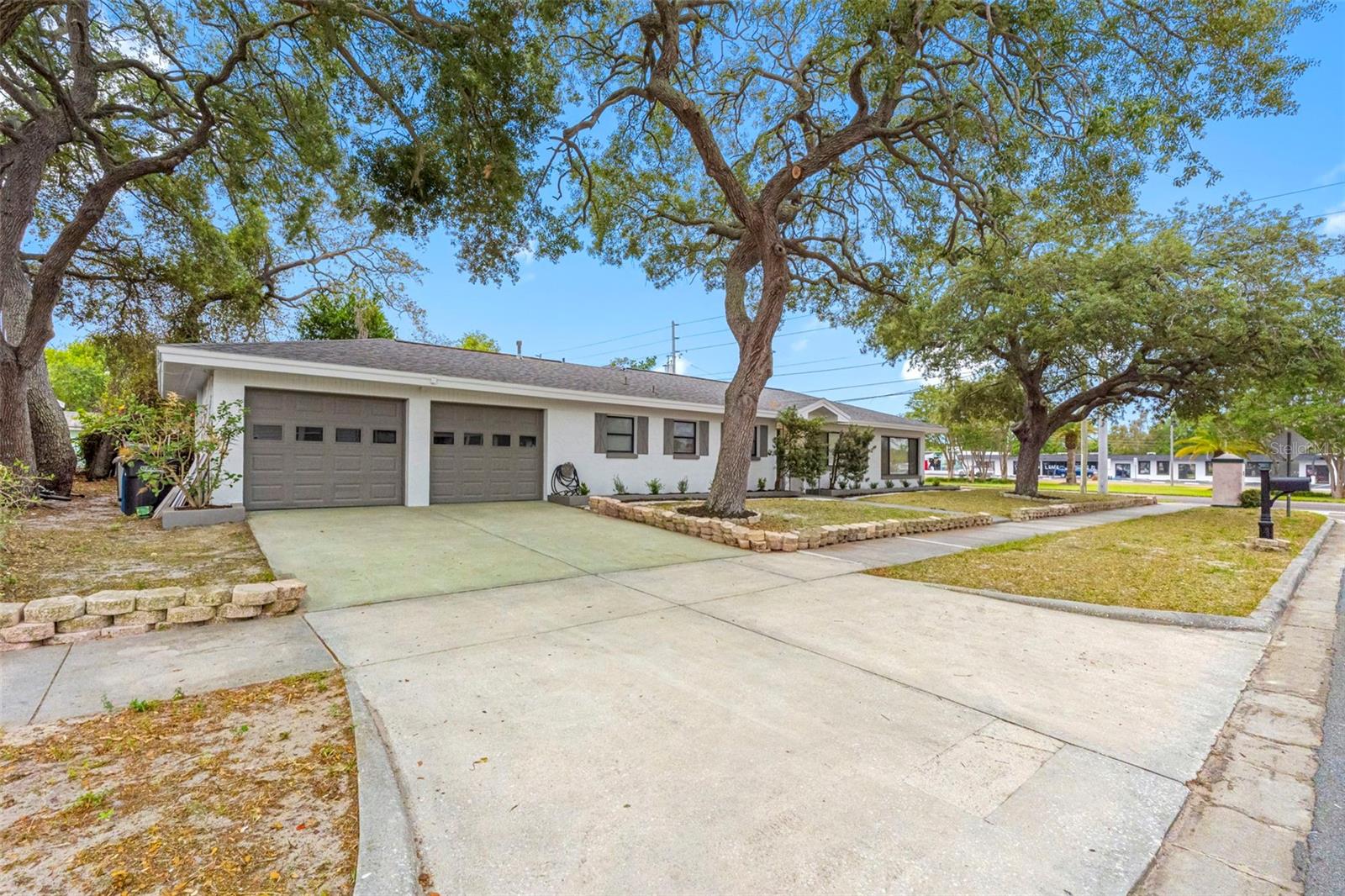Welcome to 1005 Apache Trl, a fully renovated Clearwater home offering modern updates, flexible living space, and an exceptional location just minutes from Downtown Dunedin. This 3-bedroom, 3-bathroom residence features 1,549 square feet of beautifully updated living space along with a spacious 2-car garage, all located in NO- Flood Zone X. HIGH ELEVATION! Inside, the home has been thoughtfully renovated throughout with a bright, modern feel. The updated kitchen features contemporary finishes, ample cabinetry, and a premium natural gas range — a highly sought-after feature for cooking enthusiasts that offers precise temperature control. The home is equipped with natural gas, providing added efficiency and convenience while enhancing the functionality of the kitchen. The kitchen flows seamlessly into the main living spaces, creating an inviting layout for both everyday living and hosting guests. Brand-new flooring runs throughout the home, while all three full bathrooms have been tastefully remodeled with clean, modern finishes. All renovations were completed with permitted work and carried out by licensed professional contractors, offering quality craftsmanship and peace of mind for the next owner. Additional major updates include a newer roof installed within the last five years. Natural light fills the interior, creating a warm and inviting atmosphere across the spacious floor plan. One of the home’s standout features is its location — enjoy water -views of the bay right from your front door while being just moments away from the waterfront lifestyle that makes this area so desirable. Ideally situated just moments from scenic Edgewater Drive, this home offers easy access to waterfront walking and biking paths, parks, and stunning coastal views. The location provides endless opportunities to embrace an active Florida lifestyle. Enjoy being just minutes from the restaurants, breweries, cafés, boutiques, and entertainment of vibrant Downtown Dunedin and Downtown Clearwater while still tucked away in a peaceful residential setting. With waterfront recreation, everyday conveniences, and some of the area’s best dining and entertainment all nearby, 1005 Apache Trl presents an exceptional opportunity to enjoy the very best of Clearwater coastal living.