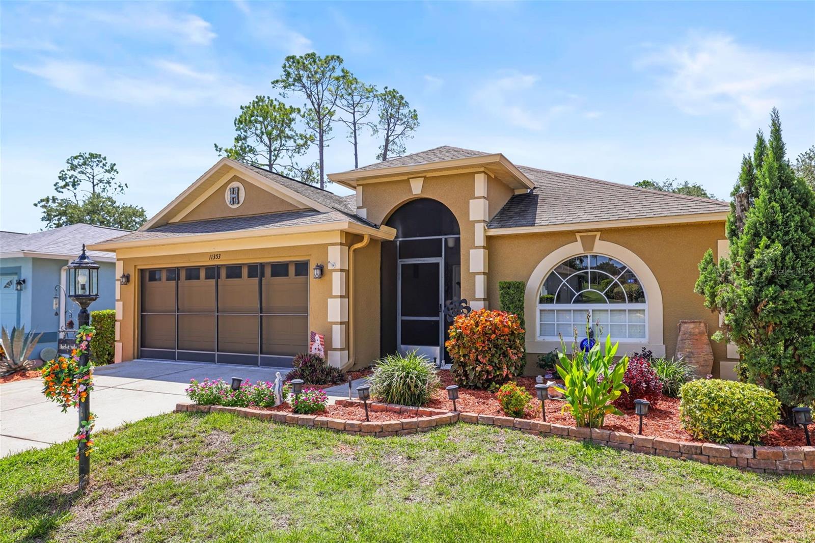 Under contract-accepting backup offers. Introducing a beautifully maintained 3-bedroom, 2-bathroom home with a 2-car garage in the highly desirable 55+ community of Heritage Pines in Hudson. Lovingly cared for by its original owner, this home offers the perfect combination of comfort, convenience, and low-maintenance Florida living.Have peace of mind with a BRAND NEW roof, updated systems and appliances, and a full house alarm system. The spacious enclosed lanai features air conditioning and new impact-glass windows, creating a comfortable year-round space to relax or entertain. Step outside to the owner's added 12' x 24' patio, perfect for enjoying the Florida sunshine.This property is being offered fully furnished, if desired, making it truly move-in ready. And for added convenience, a golf cart is included with the sale! Lawn cutting, shrub pruning, lawn treatments, and sprinkler maintenance are all included in the Village maintenance fee.Heritage Pines offers an incredible resort-style lifestyle with amenities for nearly every interest, including a golf course, pool, hot tub, pro shop, restaurant and sports bar, fitness center, tennis and pickleball courts, billiards, game room, arts and crafts, performing arts, and a woodshop. The community also features a guarded entrance and an active social calendar, making it easy to enjoy everything this welcoming community has available.Whether you're looking for a full-time Florida residence, a seasonal retreat, or a low-maintenance home in an amenity-rich 55+ community, this property is ready to welcome you home. Bring your suitcase, your golf clubs, and start enjoying the Florida lifestyle!