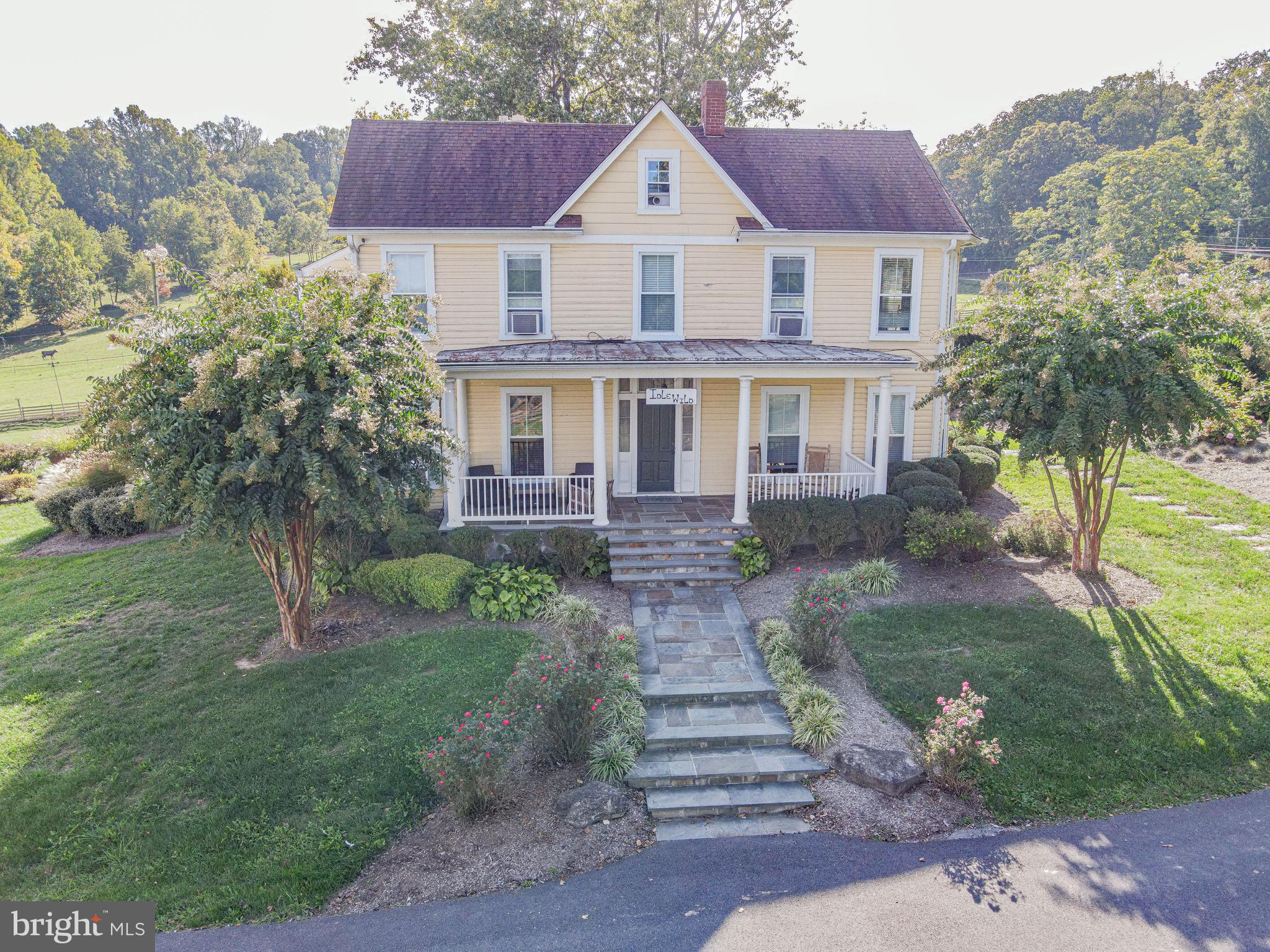 There is a prestigious 71-acre estate that is NOT PRESERVED and is now available for sale. The prime location is 26 miles to route 495 DC and 35 miles to Route 695 Baltimore. The original house was a two-story historic chestnut log home built in the 1800’s. The current luxury estate is 71 acres with 32 tillable acres, 29 pasture acres, 5 acres of woods, and 5 acres of buildings and two stocked ponds. The pasture area is fenced in currently being used for sheep and goats. The farmland is certifiably organic. The current house has 3,260 SF finished on the 1st and 2nd floor, plus a finished attic, and 1,278 SF in the lower level. The picturesque covered porch area consists of 1,025 SF overlooking the beautiful stocked ponds. The historic chestnut log home is now exposed log on the interior of the first and second floor of the estate farm house. There are four brick fireplaces, three with a flagstone hearths and woodstove inserts. There are Flagstone and Hardwood floors throughout. The kitchen, bathrooms, cabinetry and mechanicals have been updated over the years. There is a detached 29x13 bathhouse located close to the larger pond with a changing area, shower and bathroom facilities. The historic stone detached Summer Kitchen is 12x24. The original bank barn is 39x70 showcasing the historic chestnut post and beam timber. The lower level also boasts chestnut post and beam construction with horse stalls opening up to the fenced in barnyard / pasture currently being used for horses. The second barn is 25x50, the equipment / workshop is 45x80 with a 15x80 exterior lean-to area, the Quantum Hut is 38x76, and there are numerous other outbuildings. This 71 acre estate would be perfect for a wedding venue, winery, or equestrian estate!