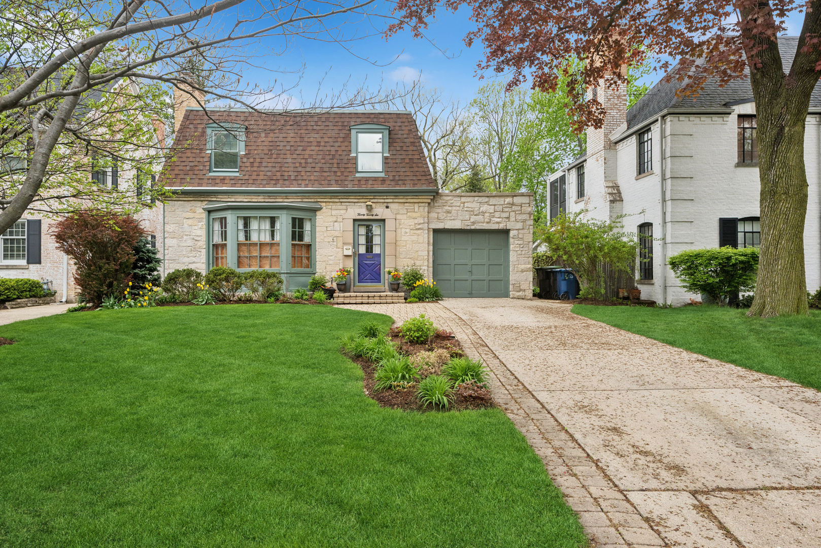 Fabulous Northwest Evanston 3 bedroom/2.5 bath stone home. Well maintained and ready for you to make this your new residence. The first floor features a large living room with hardwood floors, fireplace and a bay window which provides generous amounts of natural light. The adjacent dining room is conveniently located next to the kitchen making it the ideal spot for large family gatherings or entertaining. The kitchen is well appointed with like-new appliances (2025), generous cabinet and pantry space and granite countertops. The family room provides a more casual eating area in addition to a generous space for watching your favorite movie or just relaxing with a good book and enjoying the view of the backyard. The second-floor features three large bedrooms all with hardwood floors and double exposures for lots of light and air. The hall bath has been tastefully updated. On the lower level is a large rec room, laundry/storage room and a second full bath. Enjoy your new yard which includes many colorful perennials, dine out-of-doors on the brick paver patio and appreciate the well-manicured garden and deep green space. This home has been lovingly maintained with a new roof in 2017 and a new AC system in 2023. This is the ideal spot for putting down roots and enjoying all the North Shore has to offer.