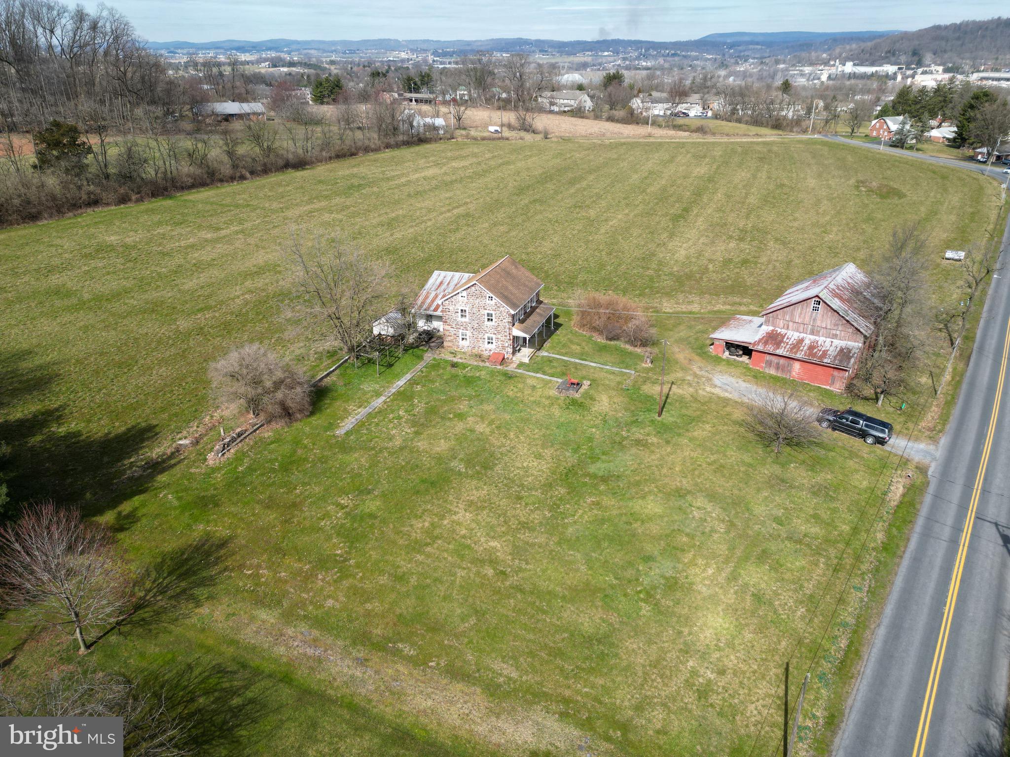 Acreage with 1875 Farm House & Barn in poor repair. Prime land for Sub-Division. Public Water & Sewer are on property and all along road frontage.   Just 1.5 miles to PA Turnpike Reading/Lancaster  interchange.