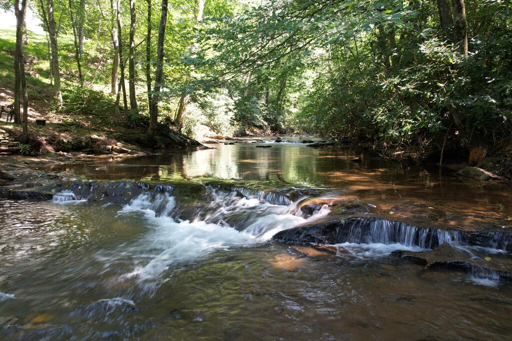Plenty of possibilities with this 28-acre tract offering privacy, recreation, and abundant wildlife. The property has been timbered and features several existing logging trails throughout, providing excellent access for ATVs, side-by-sides, hiking, and exploring. The property offers over 1,000 feet of Little Reed Island Creek frontage. Spend your days trout fishing, cooling off in the water, or simply enjoying the peaceful sounds of the creek flowing through the property. An additional small creek also runs through the land, adding to its natural beauty and character. Hunters will love this property, with abundant deer, bear, and turkey throughout the acreage. The timbering has opened up portions of the property, and with additional clearing, there is potential to create scenic views and possible building or camper sites. Whether you're looking for a hunting property, recreational tract, weekend getaway, or a place to create your own mountain retreat, this property offers trout fishing, swimming holes, creek frontage, trails, abundant wildlife, and plenty of potential. Conveniently located close to Hillsville, Galax, Mount Airy and I-77 while still offering the privacy and seclusion of a larger tract.