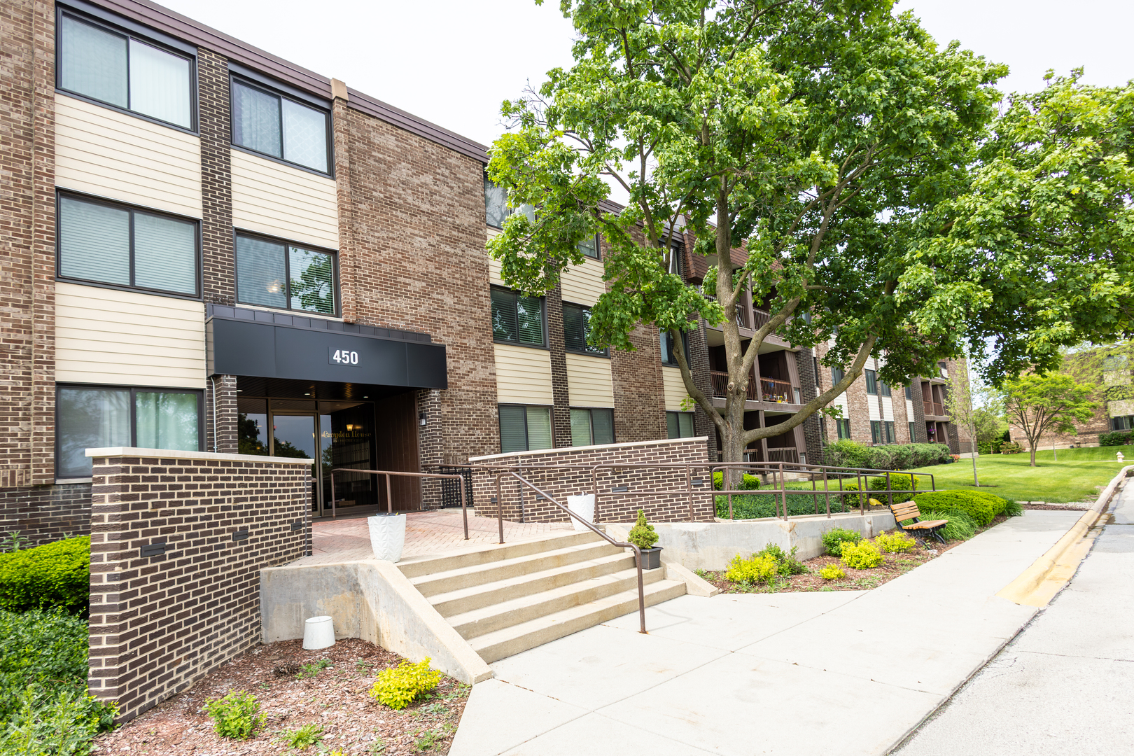 Welcome to Raintree.  Located between the Village Links golf course and College of DuPage, this completely rehabbed condo features luxury vinyl flooring, six-panel doors, sleek quartz counters and brand new stainless steel appliances.  With over 1,200 sq. ft. of living space, this spacious end unit is designed with you in mind.  The large kitchen with lots of counter space flows seamlessly into the dining room, living room and balcony, making it great for cooking and entertaining.  Relax with your morning coffee outside in the warm summer sun. Inside, the extra large master suite overlooks the golf course and features a huge walk-in closet, vanity space and private bath.  In-unit laundry hookup capable.  All electric appliances means no gas bills, and the HOA covers water, scavenger and all outside maintenance.  Raintree residents also enjoy access to a wide array of amenities including a clubhouse with fitness center, 2 swimming pools, tennis/pickleball courts, onsite management, broker owned, beautifully landscaped grounds, all just steps away.  Perfectly located near expressways, shopping, College of DuPage, downtown Glen Ellyn's charming shops and restaurants, Willowbrook Wildlife Center, Morton Arboretum, and award-winning schools, this home truly has it all.  Come see it now!