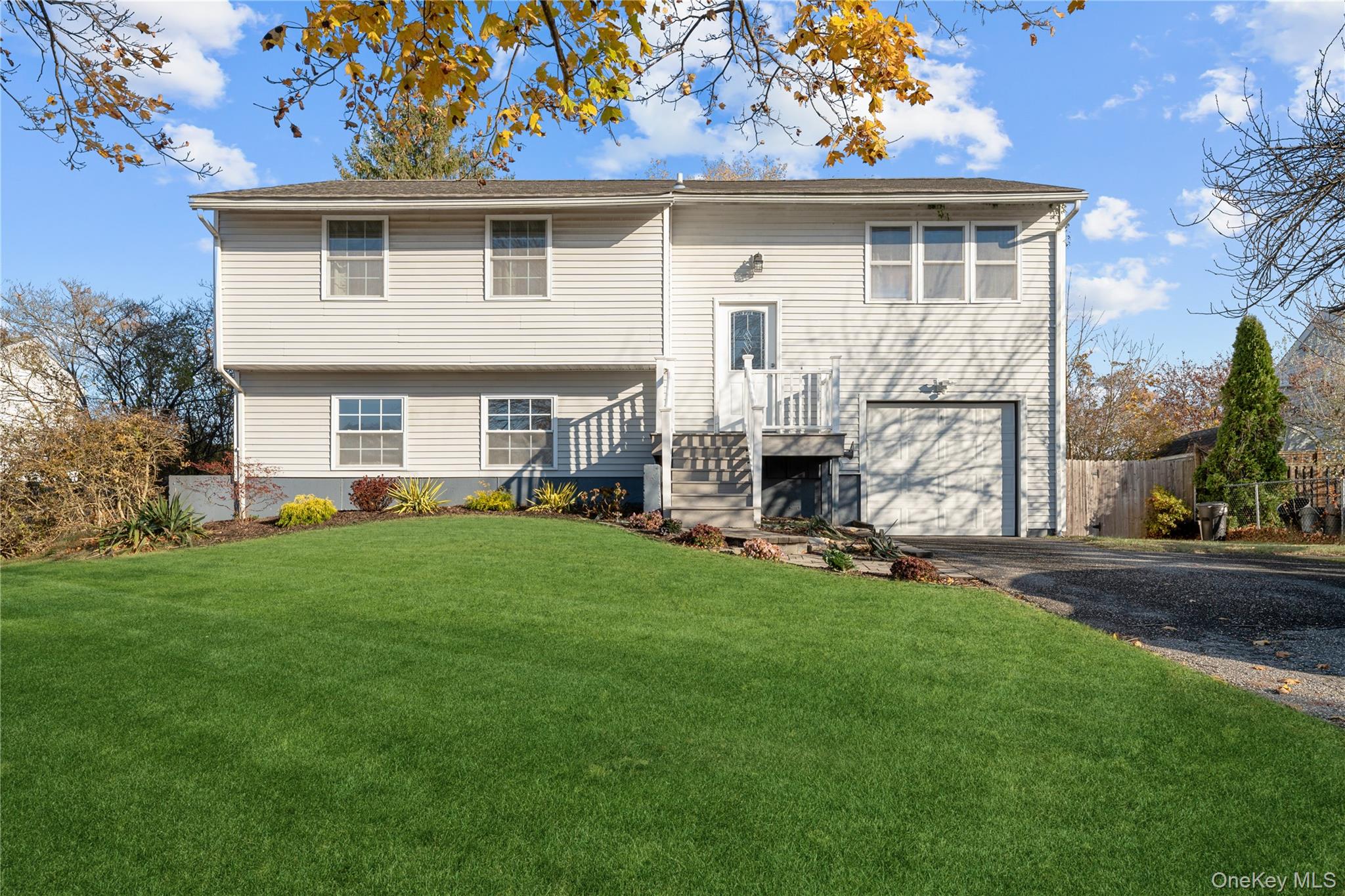 Welcome to this spacious and versatile 4-bedroom, 2 full bathroom High Ranch located in the heart of East Patchogue, NY. Perfect for extended living or income-producing potential, this home features a legal 1-bedroom accessory apartment, offering flexibility for multigenerational households or additional rental income.The upper level offers a bright and open layout with a generous living room, dining area, and an updated kitchen ideal for everyday living and entertaining. Three well-sized bedrooms and a full bathroom complete the main floor.The lower level provides even more living space with an additional bedroom, full bathroom, and private outside entrance leading to the fully legal accessory apartment, complete with its own kitchen and living area.Situated on a sizable property with ample parking and a spacious backyard, this home delivers comfort, convenience, and exceptional value. Close to local shops, parks, beaches, and major roadways - everything you need is right at your fingertips.Don’t miss this opportunity to own a home with built-in flexibility in desirable East Patchogue!