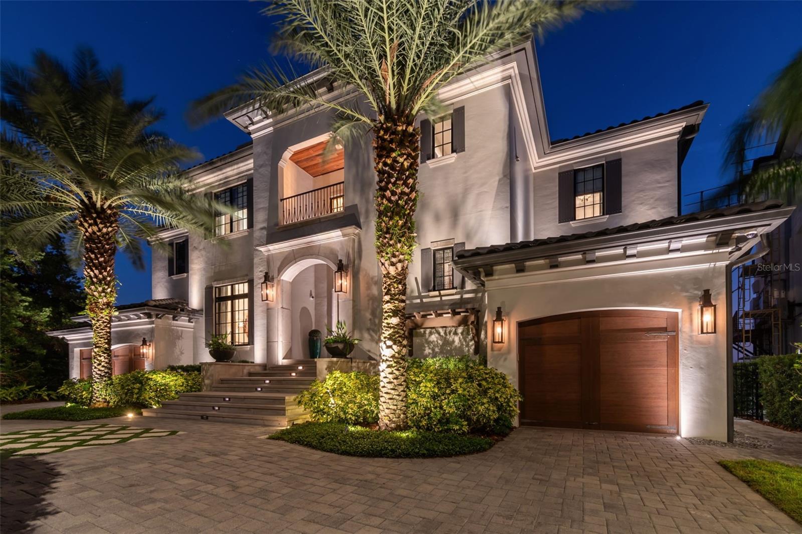 Experience the epitome of luxury in this custom-built waterfront estate by Bayfair, offering unobstructed views of Tampa Bay and beyond to downtown St. Pete and an exceptional blend of modern comfort and timeless elegance. This home is meticulously designed to capture the beauty of its surroundings while providing unparalleled luxury. Grand Entrance: As you step through the front door flanked by copper gas lanterns, you're welcomed by a dramatic two-story foyer featuring a stunning curved stairwell, setting the stage for the exquisite craftsmanship found throughout the home. Open-Concept Layout: The expansive, light-filled living space flows seamlessly, perfect for both grand entertaining and intimate gatherings. A formal dining room offers an elegant setting for hosting, while a nano-wall of windows provide breathtaking views of the water. It really makes you say WOW when you walk inside. Gourmet Kitchen & Casual Dining: The heart of the home, the kitchen, is equipped with Wolf and Sub-Zero appliances, custom stained light grey oak cabinetry, a spacious walk-in pantry, and a butler’s pantry with a wine fridge. The oversized island is perfect for meal prep and casual seating, while the adjacent casual dining area offers a bright, informal space to enjoy everyday meals with stunning views of the bay. Main Level Amenities: The first floor includes a guest bedroom with a full pool bath, a powder bath, and a mudroom/drop zone, offering convenience and practicality. Entertainment Zone: A dedicated entertainment area features a golf simulator, bar, and media room, creating the perfect space for hosting gatherings or enjoying family movie nights. Outdoor Living: The outdoor space is a true oasis, with a resort-style pool, spa, firepit seating area, and a wide covered porch ideal for dining and lounging. The outdoor kitchen, complete with a Alfresco built-in grill, makes outdoor entertaining effortless. Primary Retreat: The upstairs primary suite is a private sanctuary, featuring a sitting area with access to a private balcony offering panoramic views of Tampa Bay. It boasts a walk-in closet for two with a large island for additional storage, a spa-like bath with dual vanities, a steam shower, a jacuzzi tub, and his-and-hers water closets. Upstairs Features: Four additional en-suite bedrooms, each with spacious closets, provide ample space and privacy, a custom office with modern oak paneling and views of the bay offers a tranquil workspace. A large utility and laundry room makes those chores effortless. Garages & Storage: With split garages—a 1-car and a 2-car garage—there's room for car lifts and ample storage for vehicles or other belongings. Additional Features: A whole-house generator ensures you’re always comfortable, while high-end finishes, smart home Elan and Lutron technology systems, and energy-efficient features, such as high-impact windows and tankless water heater along with whole home water filtration system are just a few of the upgrades that make this home special. In summary, this home has it all with a floorplan that meets all the needs of a modern lifestyle as well as the construction quality and durability to make living on the open bay effortless.
