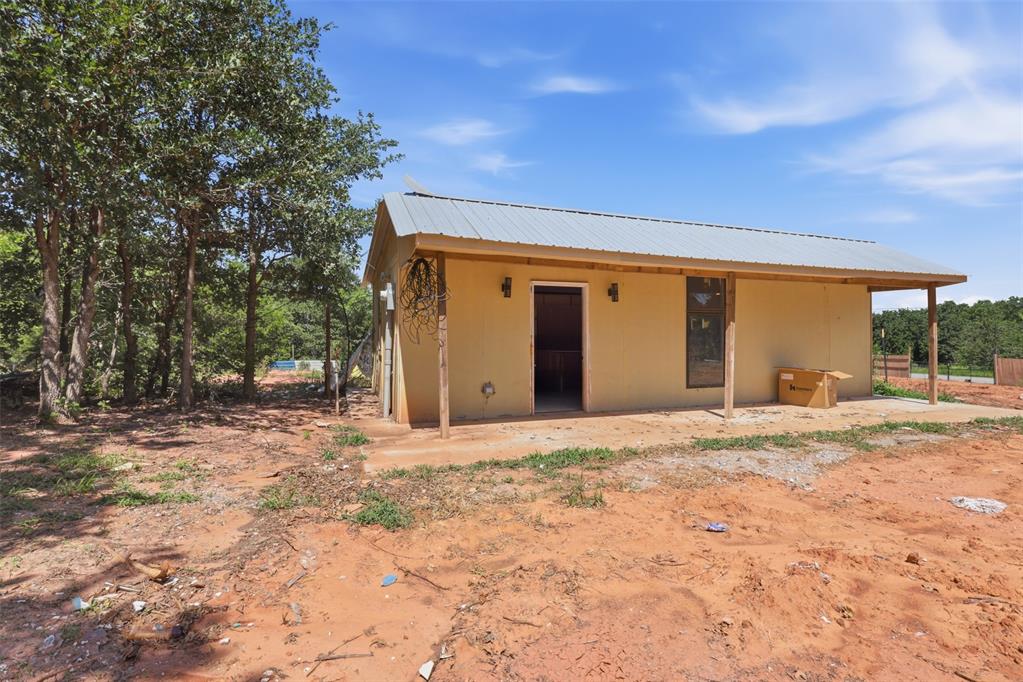Opportunity awaits just minutes from Lake Thunderbird! Situated on approximately 1.29 acres, this cabin offers a head start for someone looking to finish a unique getaway, investment property, or full-time residence. Major improvements have already been completed, including a private well, electric service, quality cabinetry, tile flooring, and modern windows.The interior is partially finished and ready for your vision. The bathroom still needs completion, and the property will require a septic system, making this an ideal opportunity for a cash buyer or someone looking to customize the final touches.Enjoy the privacy of a rural setting with mature trees while still being a short drive to Lake Thunderbird for boating, fishing, camping, and outdoor recreation. Whether you’re looking for a weekend retreat, Airbnb potential, or a project with great upside, this property offers plenty of possibilities.Property is being sold AS-IS.