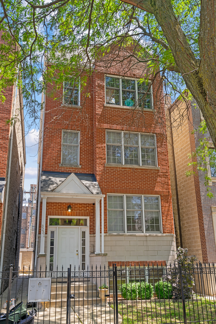 Sun drenched three-bedroom/ three full bathroom Duplex Penthouse in the heart of Lakeview in an impeccably run 3-unit building. Featuring an abundance of natural light with vaulted ceilings and skylights. The full width open floor plan is great for entertaining and flows seamlessly into the kitchen area. Enjoy a Beautiful hand-crafted fireplace. Large primary bedroom with en-suite bathroom, walk-in closet, and an amazing loft-style family room on the 2nd level.  Second primary bedroom with en-suite as well as an additional bedroom with 3rd bathroom directly across the hall on the main level.  Two large private decks (new in 2022)  are accessible from each floor and easily fits sizable outdoor furniture. One garage parking space is included, plus an oversized storage closet room. Easy stroll to Belmont stop, Southport Corridor, Wrigley Field, the lakefront, and tons of great coffee shops, bars, and restaurants.
