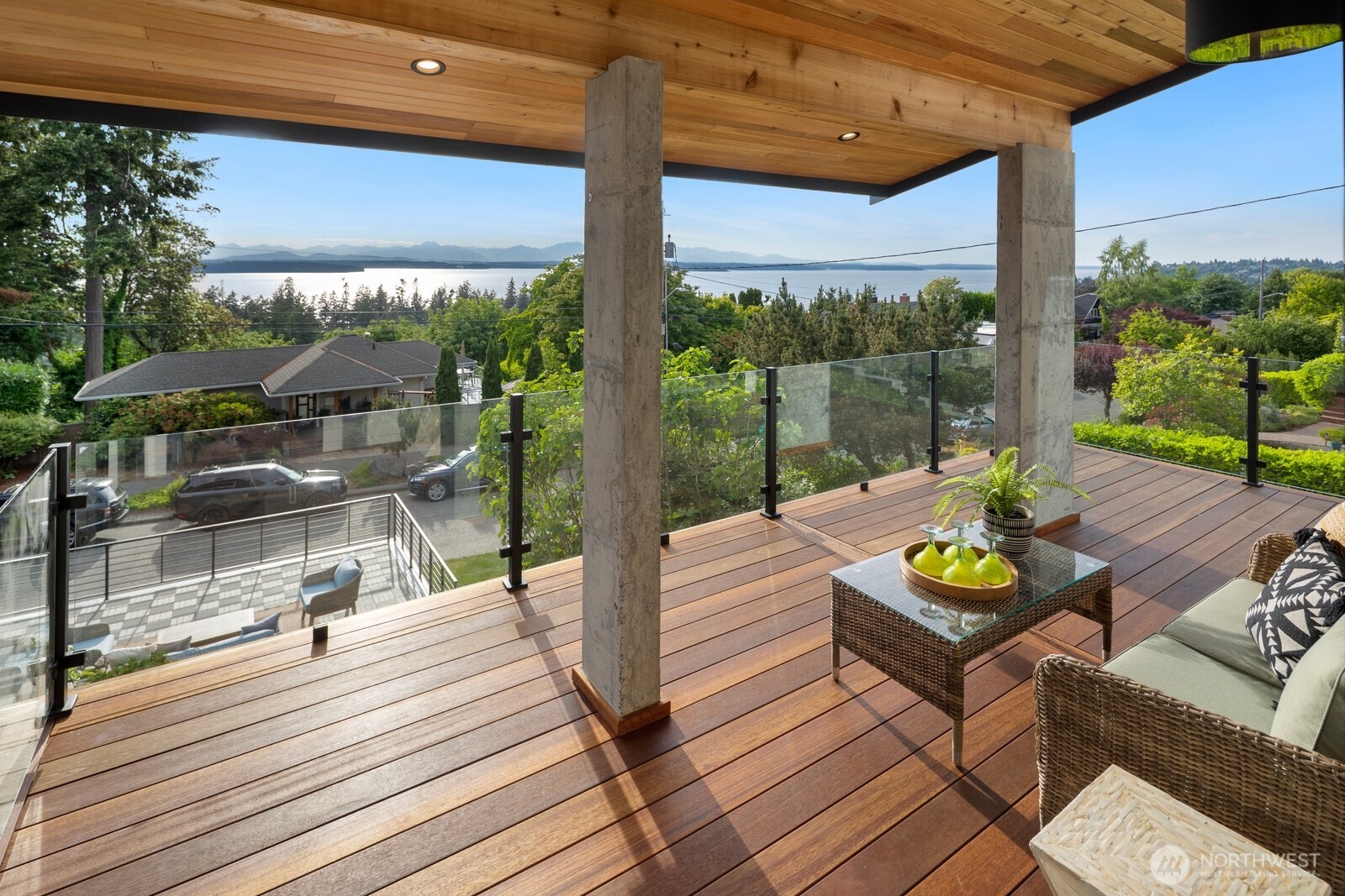 Perched to capture breathtaking panoramic views of Puget Sound and the Olympic Mountains, this completely reimagined West Seattle residence offers over 3,000 square feet of exceptional living across three thoughtfully designed levels. Taken down to the studs and meticulously rebuilt with high-end finishes throughout, this 5-bedroom, 4-bathroom home seamlessly blends modern luxury with timeless Northwest beauty.    Walls of windows frame spectacular water and mountain vistas from every level, while multiple expansive decks create effortless indoor-outdoor living and unforgettable sunset experiences. The chef-inspired kitchen flows into spacious gathering areas designed for both everyday comfort and sophisticated entertaining.    Retreat to light-filled bedrooms, including a luxurious primary suite with stunning views and spa-like amenities. Every detail has been carefully curated, from premium materials and designer finishes to updated systems and craftsmanship rarely found in today's market.     The property offers exceptional flexibility with an EV-ready two-car garage topped by a large view deck, additional off-alley parking, and a yard ideal for gardening, play, or relaxation. Mini-split systems provide heating and cooling throughout the house all year round.    A rare opportunity to own a turnkey luxury home with commanding views, modern amenities, and an unbeatable West Seattle lifestyle just minutes from beaches, parks, shops, dining, and downtown Seattle.