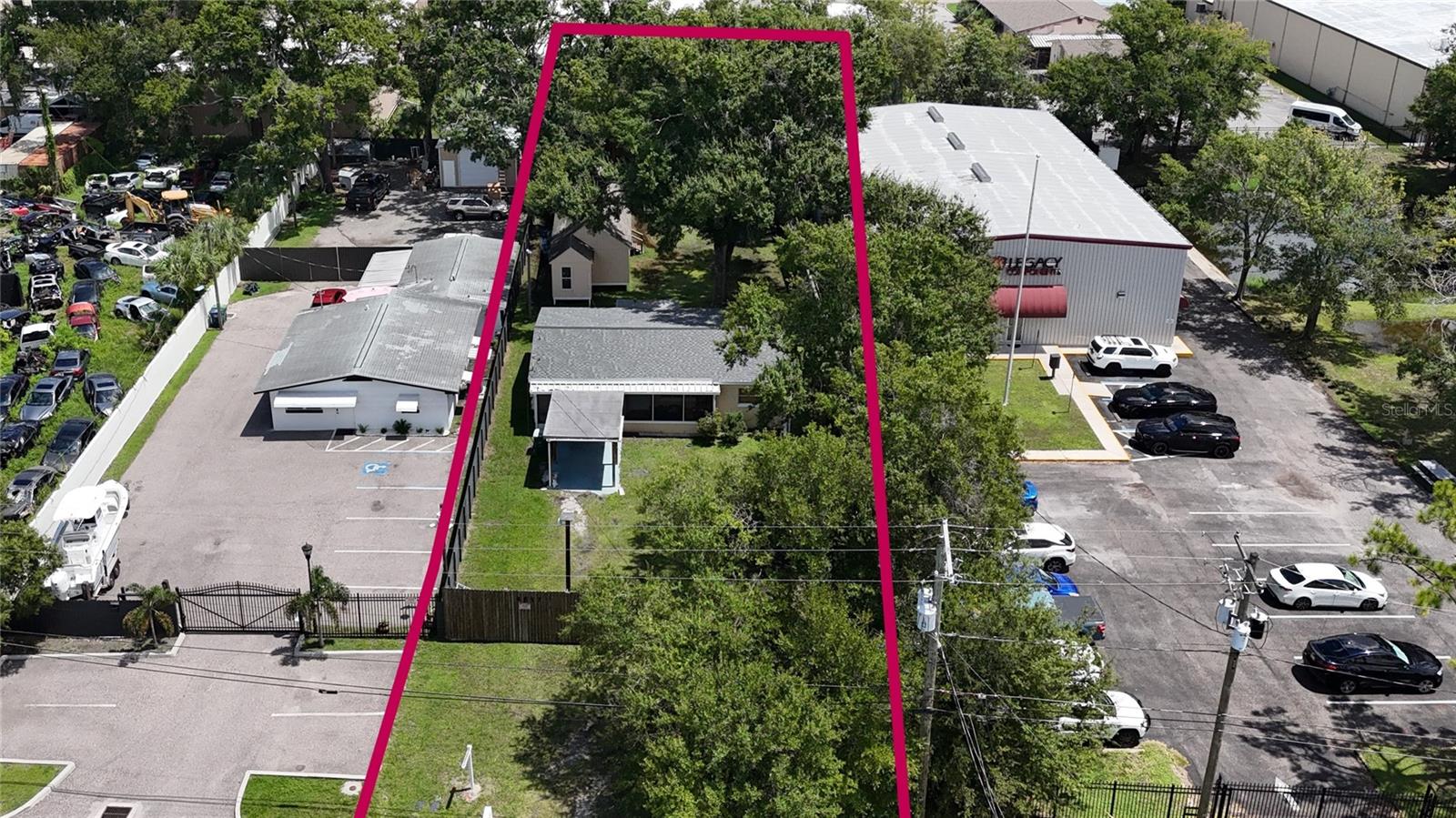 PRIME IG-ZONED OPPORTUNITY IN DREW PARK – Unlock exceptional potential in the heart of Drew Park with this centrally located property offering rare Industrial General (IG) zoning—ideal for home businesses seeking a strategic Tampa Bay location with unmatched access to major roadways, Tampa International Airport, and surrounding commercial corridors. The property currently includes a 2-bedroom, 1-bath block home of approximately 1,100 sq ft, along with two additional 445 sq ft unfinished structures that provide flexible options for future improvements, expansion, or full redevelopment. The large front and rear yard areas offer ample space for equipment storage, vehicle parking, or operational use. The IG zoning district supports a wide range of light industrial and commercial uses, including manufacturing, warehousing, wholesaling, assembly, product processing, heavy equipment and vehicle repair, and other compatible operations. Potential redevelopment concepts may include showroom/warehouse space, auto related businesses, office/service uses, or other permitted commercial applications—subject to zoning regulations. Location is a standout feature. approximately 10 short blocks from Tampa International Airport, 2 blocks west of Dale Mabry Highway, 4 blocks south of Hillsborough Avenue, Minutes to major Tampa Bay thoroughfares and commercial hubs. The property is also positioned near the future Tampa Bay Rays Stadium and mixed-use entertainment district, approved in late August 2026—a transformative $2.3B development planned for the Hillsborough Community College Dale Mabry campus in Tampa’s Westshore District. Additional nearby landmarks include Raymond James Stadium, Legends Field, Hillsborough Community College, and numerous commercial and residential amenities. This is a rare chance to secure IG zoned property in one of Tampa’s most active and evolving industrial corridors. Whether for immediate use or long-term redevelopment, the possibilities are substantial. Prime investment in a high demand location—opportunities like this in Drew Park are limited. Schedule your showing today. Seller is motivated. Thank you,