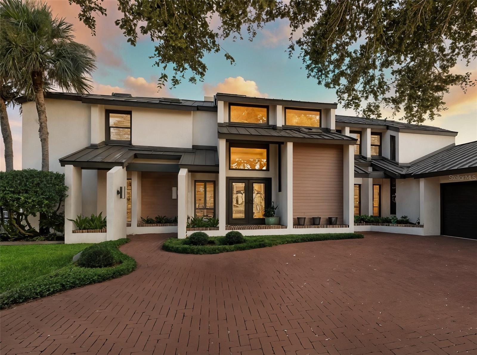 Landmark riverfront residence in the prestigious Venezia community of New Smyrna Beach. Boasting 150+ feet of prime, deep-water frontage, this classy 4 bedroom/3 bath/2 half bath home is perfectly positioned, high at the end of Venezia’s final, private cul-de-sac, offering panoramic views from nearly every room. With space for a large boat and immediate access to the Intracoastal Waterway, this handsome, contemporary home is a boater’s dream, offering fantastic living areas inside and out - Sophisticated yet comfortable, combining easy elegance with the best of Florida waterfront living. Highlights include a large pool, multiple outdoor covered patios, a private dock with a floating SUP/kayak launch, new whole home generator and a new, standing seam roof.  Adding to its appeal, 448 Quay Assisi is ideally located halfway between the vibrant arts district of Canal Street and the lively coastal energy of Flagler Avenue—offering the best of both worlds, just moments from your door.  More than a house, this property is a statement and a destination - and the epitome of all NSB has to offer.