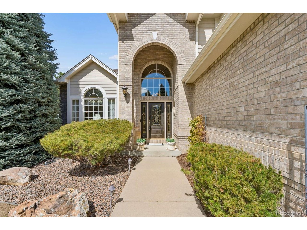 This remarkable, one owner custom home, located in the Orchard Gate neighborhood, where many seek to live, checks all the boxes! The grand arched brick front entry frames the ornate glass front door. As you enter you are greeted by extended hardwood flooring that extends through the hall, family room, breakfast nook & kitchen. The soaring vaulted ceilings & wall of windows brightens the environment in the family room where you will find a happy hour wet bar. Main floor study with closet & built-in shelving. The chef will appreciate the kitchen center island downdraft cooktop, cabinet mounted microwave, under counter lighting beneath ample cabinetry, natural granite sink, countertops & backsplash, double wall ovens, split dishwasher that can handle large or small loads + a secretary/recipe desk for meal planning. Just off the breakfast nook, through the sliding glass door, is an inviting concrete patio offering a gas grill with gas line, a separate composite deck with built-in sitting benches, mature landscaping & a waterfall that cascades into the pond. Back inside, the grand curved wood staircase, with wrought iron balusters, leads you upstairs to the primary bedroom. Walking through the French doors, vaulted ceilings amplify the spaciousness, welcoming you to the bedroom suite featuring a sitting area, perfect for relaxing before bed. Double walk-in closets with cedar accent walls, an updated primary bath which includes slipper tub, tile floors & large shower with accent tile & shampoo niche complete the retreat. Crossing the bridge overlook, you find 2 additional bedrooms served by a Jack & Jill bath + a 4th bedroom with an ensuite bath & walk-in closet. The finished basement provides valuable additional living space with a recreation room, media room with wet bar & mini-fridge, spa room with freestanding hot tub, home gym, golf putting room providing fun & memorable gatherings for all + storage room where the water softener, furnace & water heater are located.
