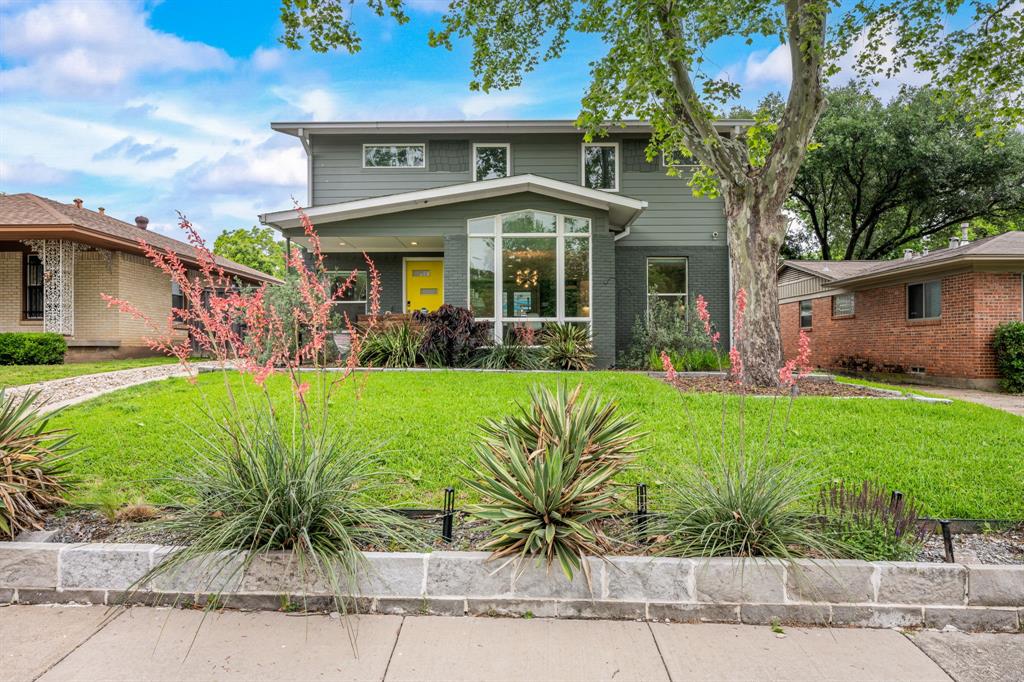 Mid-century modern style meets modern luxury in this fully remodeled Oak Cliff stunner near the vibrant Bishop Arts District, complete with a private guest quarters! 2,333 SF MAIN HOUSE + 515 SF GUEST QUARTERS! Thoughtfully updated throughout, this light-filled home features oversized windows, rich hardwood floors, and a seamless open-concept layout that blends style and functionality. The sleek kitchen is outfitted with a large island, Bosch appliances, including a gas range, two dishwashers, under-cabinet lighting, and a spacious walk-in pantry. The living room flows easily into the dining area, laundry, mudroom and backyard. There is a second living area downstairs great for a den, gym or office!Upstairs, a dedicated office landing offers a functional workspace in addition to the three upstairs bedrooms. The spacious primary suite features dual vanities, a massive shower and clawfoot tub. Smart features abound, including Lutron lighting, electric shades, and windows that are UV film protected, offering both energy efficiency and peace of mind.Outside, the detached two-car garage (with carport and upgraded voltage) includes fully equipped guest quarters above—complete with kitchen, bath, and Murphy bed, ideal for visitors or rental income.The private backyard is a true oasis with a heated stock tank pool, large deck with built-in seating, and a grilling area that makes entertaining a breeze. Don’t miss this rare opportunity to own a stylish, turn-key home with exceptional indoor-outdoor living and guest accommodations in the heart of Oak Cliff.