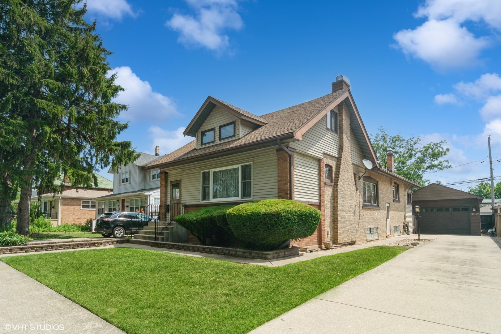 Ideal Edison Park Location - Oversized Lot with Endless Potential.  Located on a rare 49x118 oversized lot in the heart of Edison Park, this charming brick & vinyl Queen Anne Bungalow offers a spacious layout with excellent potential for updates, expansion, or a full second-floor renovation. A wide space on south side of house allows for driveway that leads to a 2-car garage with a second overhead door opening to the alley for added convenience. The main level features an inviting enclosed front porch with a swing, a generous living room, a formal dining room, and a granite kitchen with oak cabinetry and space for a table or island. Two bedrooms, a full bathroom, and an enclosed rear porch with sliding doors to a large deck complete the first floor. Upstairs, you'll find a sitting room leading with closets leading to two additional bedrooms, and a large unfinished attic offering incredible potential for customization. The finished basement includes a spacious recreation room with a dry bar, full bathroom, laundry room with extra storage, and a large utility/storage area. Recent updates include: boiler (2015), LeafGuard gutters (2013), deck (2013), roof (2012), vinyl windows/patio door (2011 & 2006). Just steps to the EP METRA stop, popular restaurants, and the soon-to-open EP Market at the end of the block. Don't miss this opportunity to make your mark in one of Chicago's most sought-after neighborhoods!