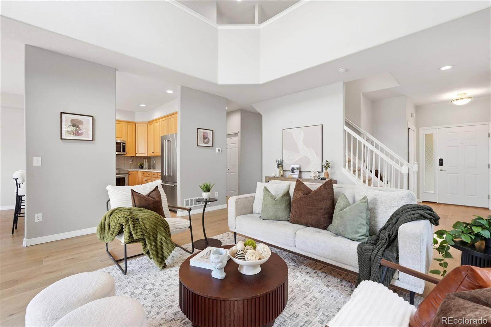 Tucked in the trees and surrounded by open space trails, there’s not a bad view in sight from this end unit in desirable Wild Ridge. This immaculately maintained 3-bedroom home is turnkey, cozy, and oh so inviting. The bright, thoughtful layout features timeless details throughout: light wide-plank wood floors, vaulted ceilings, large windows, a corner gas fireplace, neutral paint, and clever built-ins in the entry and mudroom. The updated kitchen showcases a seamless counter-height bar, quartz countertops, stainless appliances, tile backsplash, and under-cabinet lighting, while the adjoining dining area is a great perch to gaze over the neighborhood trails leading to the Rec Center and Old Town Lafayette. The lofted upper level overlooks the living area below and features a spacious primary suite with a five-piece bath and walk-in closet, plus two secondary bedrooms connected by a Jack-and-Jill full bath. Furnace and AC replaced in 2023. The unfinished basement, complete with large windows, offers flexible space to suit your current and future needs, along with ample storage, a utility sink, bath rough-in, and workbench. Other perks include a covered front porch, sliding doors to a covered back patio backing to the neighborhood greenbelt, and shelves, bike racks and an EV charging station in your 2 car garage. HOA covers roof, exterior, water/ sewer, trash, snow removal, and landscaping. Across the street from Lindenwood Park, Rothman Open Space, and just minutes from extensive trails, shopping, local restaurants, and cafes, with easy access to Old Town Lafayette. You can't beat this location!