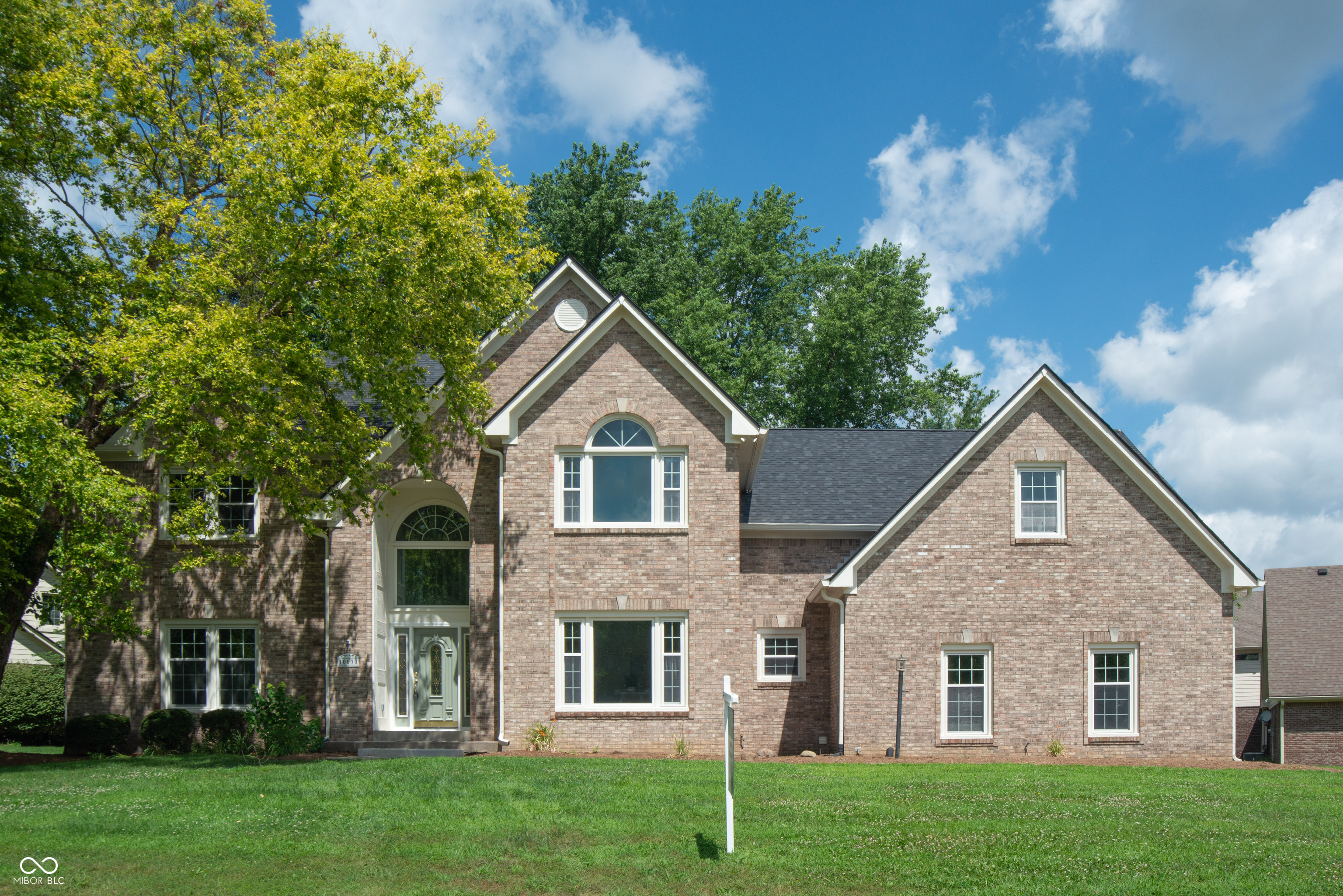 Searching for the luxury house of your dreams? Look no further than this beautiful home in sought after Hamilton Proper! All of the 5 bedrooms and 4.5 baths have been meticulously renovated, just as the rest of the house. Immediately be impressed by all the light and openness as you step into the vaulted entryway. Then make your way to the spacious living room and cozy up to the custom-built limestone fireplace. Check out gorgeous kitchen where no detail is spared: Brand new stainless steel appliances including a wine fridge, under the counter microwave, 36-inch range with a convenient pot filler and custom hood. The counter tops and full back splash are a beautiful white quartz with gold accent. The openness and lightness continues with the luxury vinyl plank flooring throughout all levels of the house. Main bedroom also boast vaulted ceilings, unique color changing light fixture that can be controlled with a phone app, and a spa-like ensuite bath that you'll never want to leave. Need a 2nd main bed? Check out the biggest bedroom in the house just down the hall with also its own en suite. Perfect for a giant playroom or even a home theater. Need more space? Check out the finished basement completed with a wet bar and bonus room. It's basically a separate living space! Did I mention this is also a waterfront property? Enjoy the view of the duck pond from the brand new deck, and maybe even go fishing. Round it all off with 3 car garage for all your parking needs. What are you waiting for?!