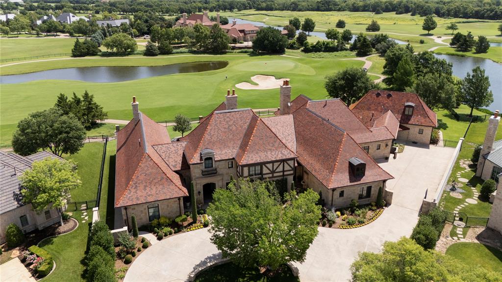 Perfectly positioned on a prized near 1 acre Estate lot overlooking the 10th green of Gaillardia, this extraordinary single-level residence offers panoramic lake and golf course views. Designed by Pat Fox (Tulsa) Steve Blair of OKC, and built by Gil Wright, the home is a masterclass in architectural elegance and quality. 

Five generously sized bedrooms each have private en-suite baths, with two additional powder baths. A guest cottage wing down a central hall features two of those suites connected by a living area, and patio—ideal for guests or multi-generational living, & also has its own private exterior entrance if needed. 
Two expansive living areas showcase stunning views and are anchored by a hand-carved, two-sided limestone fireplace imported from Italy. Additional features include a game room with 22-ft ceilings and custom beams, climatized wine/safe room, geothermal HVAC, heated limestone floors, Kolbe windows, and solid white oak doors. 

The chef’s kitchen, by Classic Kitchens, includes a six-burner gas stove, three ovens, two sinks, dishwashers, and a walk through pantry. A private office with pocket doors opens to a charming herb garden with asparagus, thyme, and tarragon.

 A unique dog room accessed from the exterior is heated and cooled and could also be a potting shed or studio. The professionally refreshed landscaping by Total Environment provides privacy and year-round beauty. Two attic spaces offer flexibility: one, near the front entry, is plumbed, sheet rocked, heated, and cooled for future build-out of approx 1000 sq ft. The other, over the garage, is climate controlled with cabinetry, a large island, and workspace for hobbies or storage. 

A covered patio with outdoor fireplace and overhead heating/cooling could be turned on for comfort ideal for outdoor living. A Generac Guardian generator powers most of the home.  A rare opportunity to own one of Gaillardia’s most iconic and thoughtfully designed homes.
