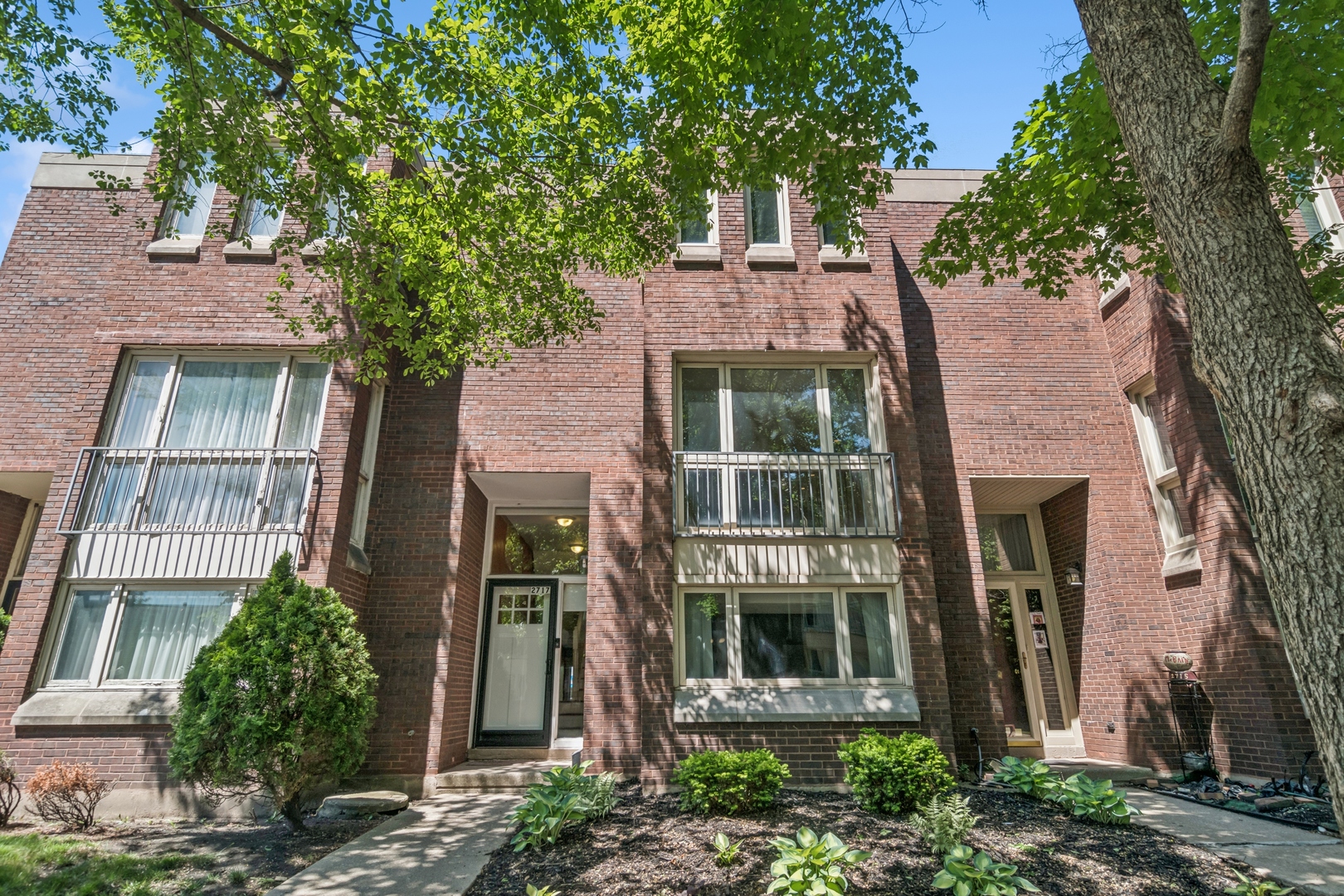 Incredible bang for the buck! Rarely available and highly coveted 3 story fee simple townhome in private and tranquil courtyard community that offers incredible space and updates...truly a must see! Be welcomed into this incredible home via a proper and dramatic foyer with fun feature wall and sightlines directly to either the lower level or to the main level. This wide unit has been updated throughout and offers some of the best features that today's buyer is looking for including an open kitchen and floorplan that is ideal for entertaining. Oversized and bright kitchen includes floor to ceiling windows, new floors, painted cabinetry, custom backsplash plus generous island for additional seating. This flows perfectly into the separate dining area where you will have room for your largest gatherings and leads out to your private balcony overlooking the stunning new yard. This level also includes a living room that is roomy enough for 2 seating areas and has a beautiful bay window overlooking the tree lined courtyard. Gorgeous refinished hardwood floors and stairs lead up to the bedroom level with skylight, new closet doors, updated bathroom with stylish black vanity with stone tops, custom light plus anti fog mirror. The huge primary suite is a dream with reading lights on the bed wall, a full wall of closets, seating area in the bay window with tree top views and updated porcelain bath featuring stand up shower with mud pan base & custom mirror and light. Want more? How about an additional family room with LVP flooring, another full updated bathroom and bedroom with 2 closets!! Enjoy endless storage space throughout the home with several dedicated "bonus" spaces as well as a laundry room with side by side washer and dryer and utility sink. Aside from the move in ready condition and space, the best part might just be your private oasis right off the family room.....where else can you find a brand new yard with plenty of green space for playing or just chilling plus the privacy of your own enclosure and perimeter landscaping. Chef's kiss! Exterior parking space directly behind the home truly completes this rare offering. Unit is in good condition but being sold as-is***BUYER FINANCING FELL THROUGH DAYS BEFORE CLOSING DUE TO JOB LOSS***