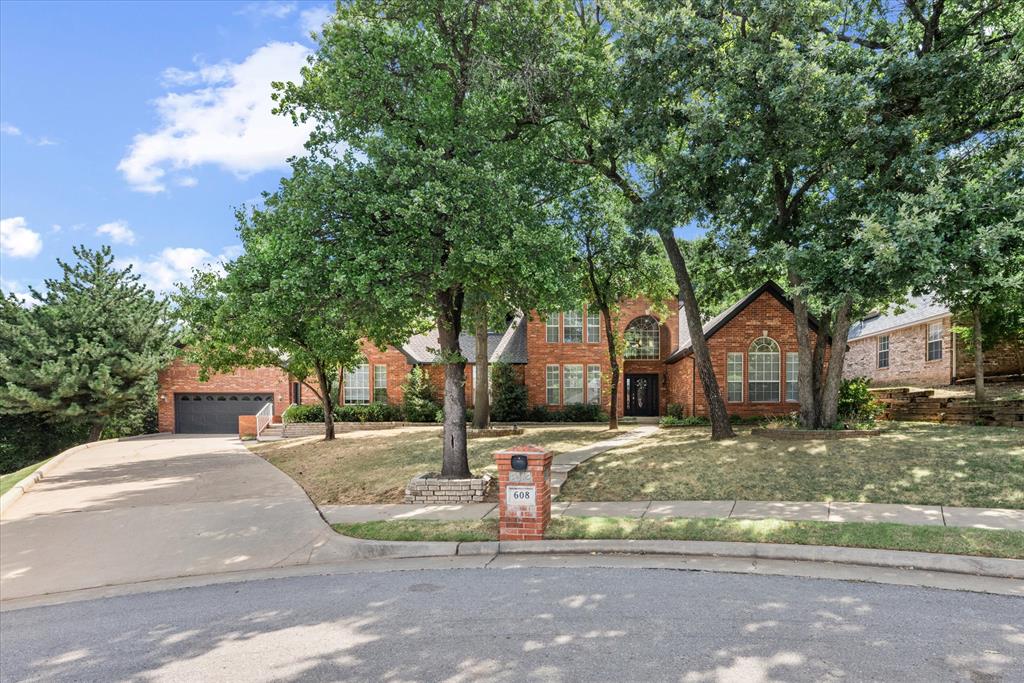 This exceptional two-story estate offers the perfect balance of timeless elegance and modern sophistication. Nestled in the serene Fox Lake community, the home is thoughtfully designed with 2 spacious living rooms, 2 dining areas, 3 downstairs bedrooms, plus an upstairs study or optional 4th bedroom.

The main level features an open-concept design with soaring ceilings and expansive windows that flood the interiors with natural light. The family room, anchored by a striking fireplace, flows seamlessly into the chef-inspired kitchen—complete with a center island, abundant cabinetry, and generous workspace.

The primary suite is a true retreat, with private access to the lush, treed backyard—perfect for morning coffee or sunset views. The spa-like ensuite offers a modern vanity, luxurious jetted soaking tub, and walk-in tiled shower. Two additional downstairs bedrooms each feature walk-in closets, bright windows, and spacious layouts.

Upstairs, the study provides flexibility for a home office or 4th bedroom. Abundant storage throughout makes organization effortless.

Outdoor living shines with a covered patio overlooking a private backyard oasis—ideal for entertaining or quiet evenings at home. Additional highlights include a 3-car tandem garage (662 sq ft MOL).

Fox Lake residents enjoy community amenities such as a neighborhood pool and playground, along with quick access to shopping, restaurants, hospitals, and entertainment. Families will also appreciate being part of the highly sought-after Edmond School District.

Welcome home!