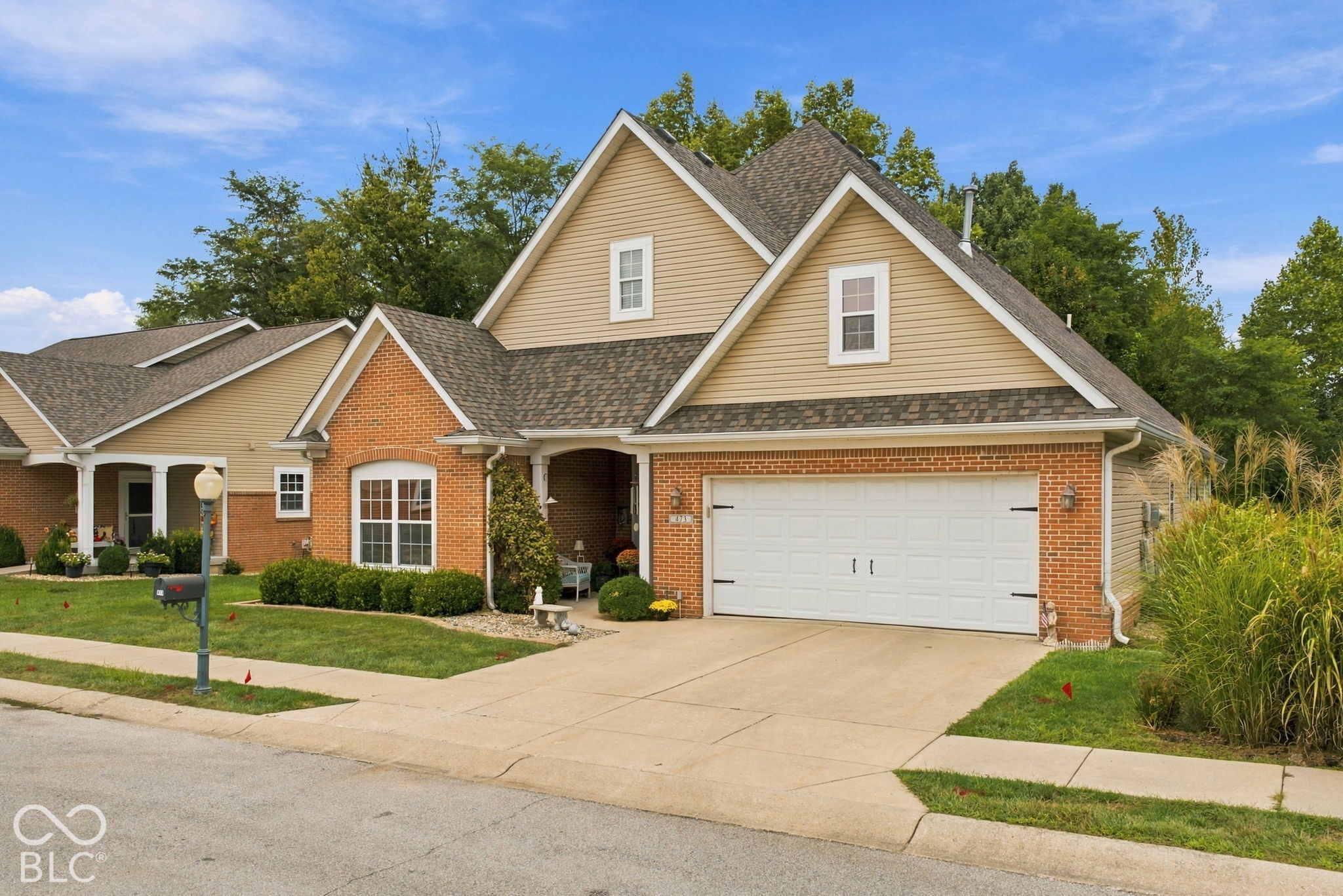 You can't beat this 3 BR, 2 Full BA, 2,559 stand-alone condominium home in Autumn Glen Village in Greencastle!  This one has SO MUCH TO OFFER!  Located on one of the most desirable lots in Autumn Glen Village, this one backs up to trees and a wooded view.  Enjoy privacy, peace and quiet on your back patio as you overlook nature and feel like you are in the country instead of in town.  This open concept home features a large 24x22 Great Room with soaring cathedral ceiling, gas fireplace and double glass doors leading out to the back patio.  The Great Room opens up into the Dining Room and Kitchen with ceramic tile flooring, tile backsplash, center island and stove, refrigerator, dishwasher and microwave all included.  The Primary BR Suite is stellar with a large Primary BA with double sinks, garden tub, ceramic tile flooring and separate oversized shower with corner seat.  BRs #2 and #3 are located on the other side of the home, along with the Sun Room with glass door leading to the back patio AND a massive upstairs Bonus Room over the Garage that is 22x11 and currently serves as BR #4.  Large Laundry Room with ceramic tile flooring, utility sink, lots of cabinet and countertop space for folding, plus front-loading washer & dryer included.  2-car finished Garage, BRAND NEW ROOF IN MAY 2026, water heater only 1 year old and water softener included, as well.  Don't miss out on easy living!
