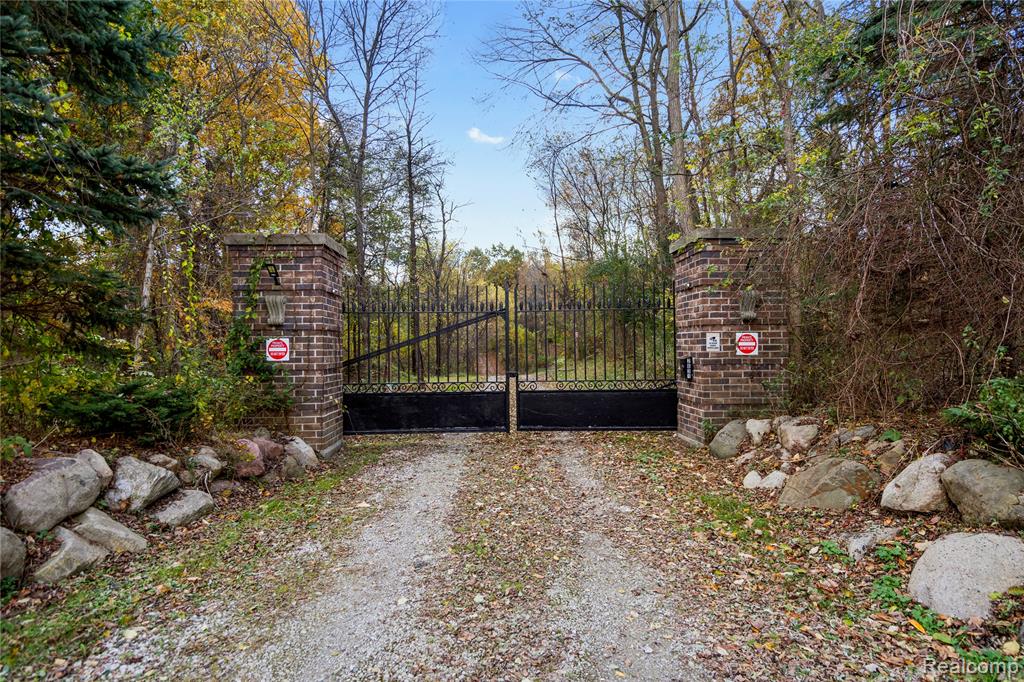 Experience modern luxury and timeless charm in this fully remodeled Cape Cod home, nestled on nearly 7 acres of serene countryside. Behind a private gated entry, this property has been redesigned from top to bottom, featuring all brand-new finishes, fixtures, and mechanicals — truly move-in ready with nothing left to do but enjoy.Located just 10 miles from downtown Rochester and less than 5 miles from downtown Oxford, the home offers the best of both worlds — peace and privacy with easy access to vibrant suburban amenities, restaurants, and entertainment. Inside, the home boasts a bright open floor plan perfect for entertaining, complemented by a spacious covered front porch and a walkout basement that expands your living space. Every room showcases modern craftsmanship and thoughtful design, from the stunning kitchen and bathrooms to the custom trim and flooring throughout. For those who need space and flexibility, the property includes a 40x60 all-metal barn ideal for storage, hobbies, or workshop use, plus a two-story, three-car garage with a separate entrance that could be transformed into a great room, in-law suite, or home office. Additional highlights include a whole-house generator, a charming “she shed,” and room for chickens, goats, cows, and more — perfect for anyone dreaming of space to roam and live freely.If you’ve been searching for a completely renovated home that combines modern living with country tranquility, this property is your dream come true.
