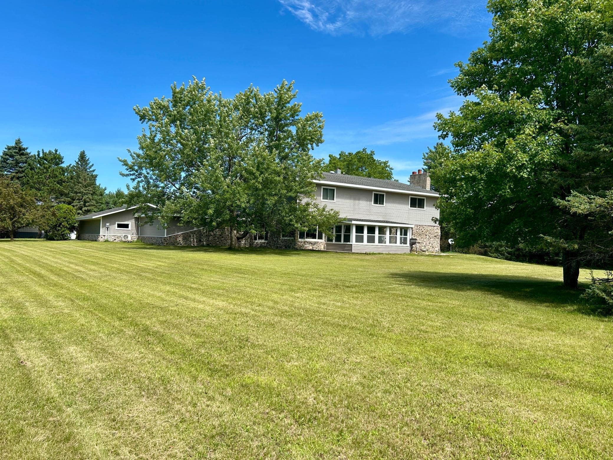 Price reduced to allow for buyer to replace flooring materials if desired. Amazingly designed and constructed large rural home. 4 bedroom 4 bath home on 7.27 acres with amazing 28 x 40 shop with 16' sidewalls, insulated and heated built in 2022. Recently new siding and Anderson windows. Beautiful slate flooring, open spiral staircase, magnificent parquet ceilings are just some of the perks of this home.