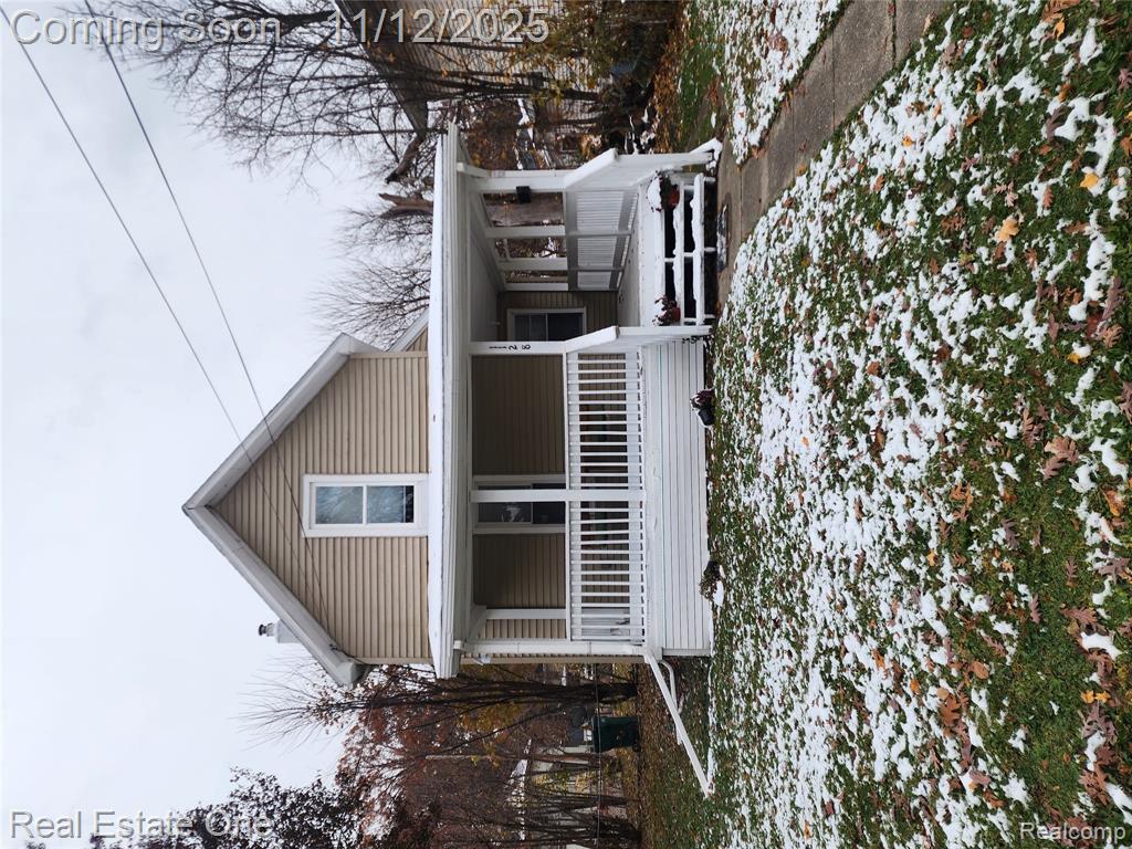 Welcome to 1128 Hickory Street in Lansing-a beautifully renovated two-bedroom home that perfectly blends modern updates with classic charm.  Situated on a spacious corner lot with a large yard extending beyond the fenced area, this move-in-ready property features fresh interior paint, new appliances, and an updated kitchen with a unique slide-out counter that doubles as an island, under cabinet lighting, and elegant finishes.  The main floor includes a bedroom and convenient laundry area, while the updated bathroom showcases stylish fixtures and a light up faucet.  Recent upgrades include plumbing and electrical systems, along with a freshly poured concrete basement floor that adds both durability and usable space.  Upstairs offers a second bedroom and a versatile flex area ideal for a home office or study, and outside the inviting wrap-around porch invites the perfect space for relaxing or entertaining.