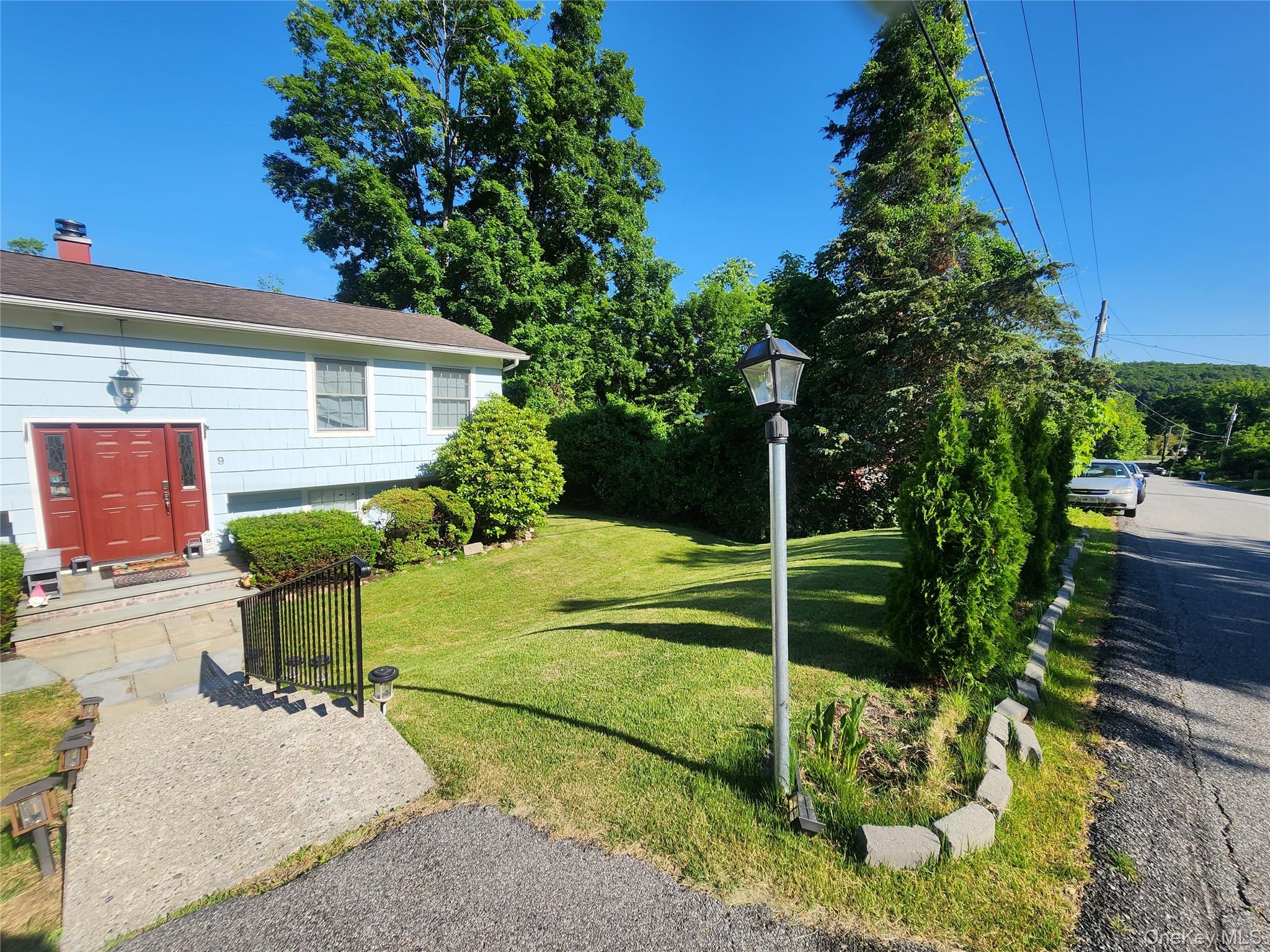 Welcome to this turnkey charming ranch! It offers an open concept and spacious rooms. Top floor offers two bedrooms, a full bathroom, kitchen with quartz countertops, finished wood floor, and updated bathrooms. Lower floor offers a family room with sliding doors that lead to a completely private deck with scenic views, a full bath, bedroom, and an office that can be used as a fourth bedroom.