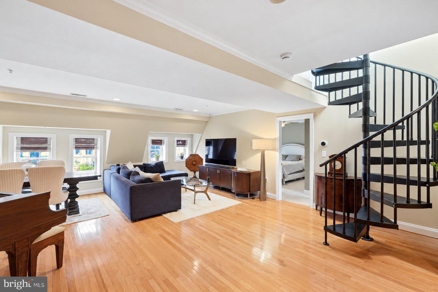 Welcome to this spacious 2-bedroom, 2-bath penthouse ideally located in the heart of Mount Vernon Triangle! Offering approximately 1,344 square feet of living space, this unique top-floor condo features windows on three sides, filling the home with natural light and creating a bright, open feel throughout. The large eat-in kitchen features stainless steel appliances, ample cabinet and counter space, and flows seamlessly into the expansive living and dining area, providing plenty of room for everyday living and entertaining. Both bedrooms are generously sized and feature their own private ensuite bathrooms, offering an ideal layout for roommates, guests, or a dedicated home office. Hardwood floors through main areas, great storage, in-unit washer and dryer, and a newly replaced energy-efficient HVAC system and water heater add to the comfort and convenience of the home. One of the standout features is the private rooftop deck with panoramic views across Washington, D.C.—a fantastic space for entertaining, relaxing, or enjoying the city skyline. Located in a boutique elevator building with only two residences on the top floor, the home offers a level of privacy that is hard to find in the city. The location is tough to beat. Safeway is right around the corner and the Mount Vernon Square Metro, Walter E. Washington Convention Center, Carnegie Library and Apple Store are just a few blocks away. CityCenterDC, Chinatown, Penn Quarter, and an abundance of restaurants, coffee shops, shopping, and entertainment are all within fast reach. Enjoy everything downtown DC has to offer while coming home to a spacious and private penthouse retreat!