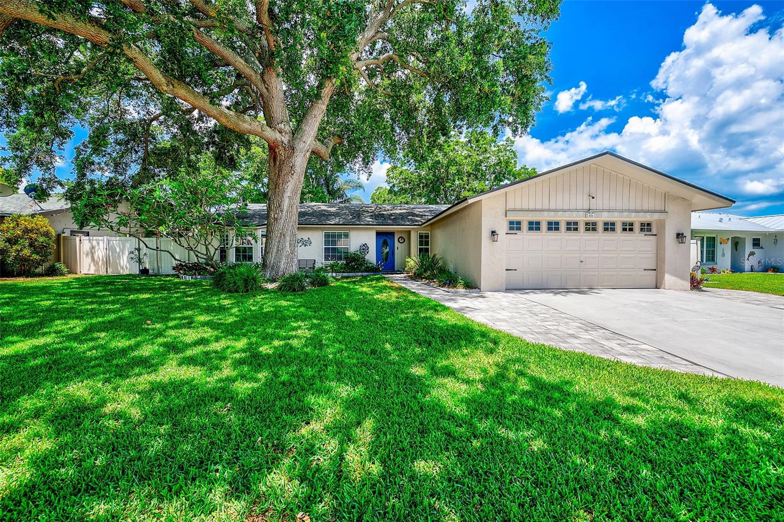 Under contract-accepting backup offers. Welcome to this beautifully maintained, move-in ready 3 bedroom, 3 bath, pool home. Located on a quiet cul-de-sac just five minutes from vibrant downtown Dunedin in a desirable golf cart friendly community. Offering a spacious split floor plan with tile flooring throughout, this home combines comfort, functionality, and the best of Florida living. The updated kitchen features quartz countertops, modern stainless steel appliances, and opens seamlessly to the main living areas, making it perfect for both everyday living and entertaining. The true highlight of this home is the outdoor living space including night lighting. Enjoy a beautiful screened in pool area surrounded by tropical landscaping, a fully private fenced backyard, with plenty of room for pets and outdoor activities. A completely updated full pool bath adds even more convenience for guests and entertaining. The primary suite offers direct access to the pool area along with an updated en-suite bath featuring a walk-in shower. The second bedroom includes an attached bonus room with wood-burning fireplace and sliders leading to a private patio with direct pool access, creating a flexible space that feels more like a private in-law suite or guest retreat. The third bedroom has a pool view and plenty of storage.  Recent updates include LED lighting, newer ceiling fans, newer interior doors, Roof (2017), HVAC (2017), and New Electric Panel (2025).  Additional features include an X flood zone location, no HOA, and close proximity to Honeymoon Island State Park, local restaurants, shopping, airports, and highly rated schools.