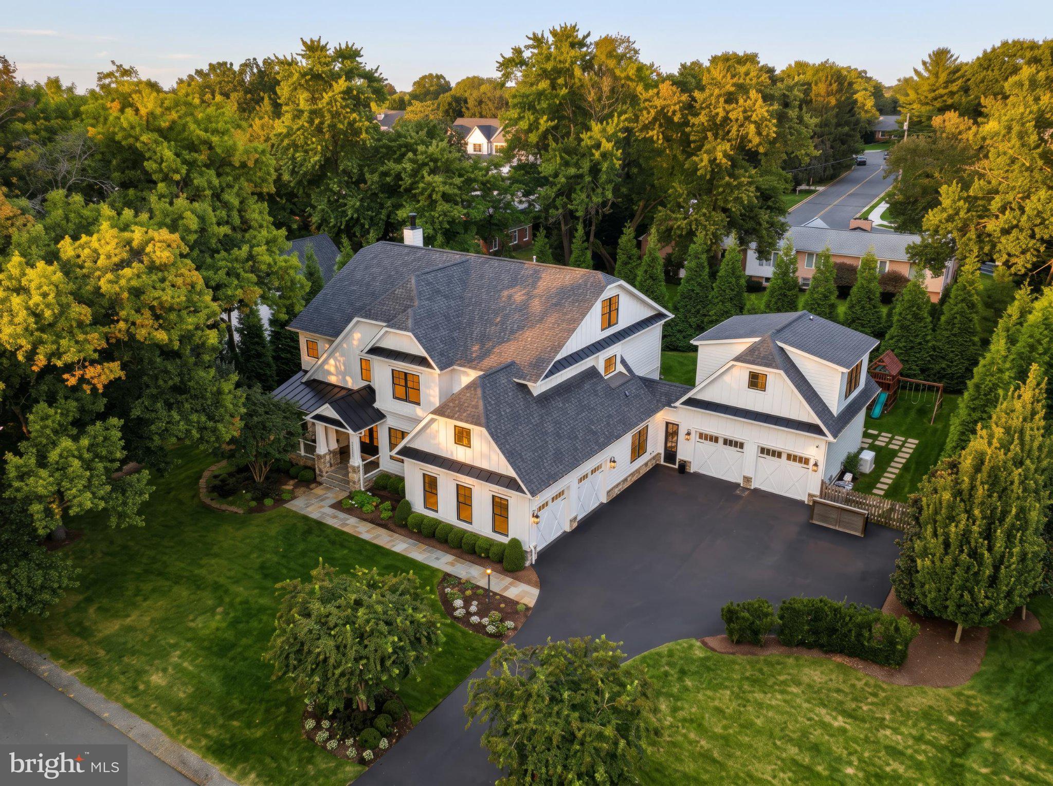 Welcome to 402 Mashie Drive SE, a remarkable custom residence by Cloud IX, ideally positioned on one of the most beautiful and established streets in the Town of Vienna. Mashie Drive is known for its wide street, mature trees and true neighborhood feel.Here, everyday life offers the charm of a small town with exceptional accessibility. Walk the dog, go for a run, access the W&OD Trail, nearby parks, Whole Foods, and Westwood Country Club, while Tysons, Washington, DC, and major employment centers remain within easy reach.Custom built by Cloud IX, this residence combines craftsmanship, technology, comfort, and everyday functionality. The exterior features Hardie and shake shingle siding, stone accents, architectural shingles, professional landscaping, security cameras, a large driveway, and an impressive four-car garage.Inside, natural red oak hardwood flooring, custom lighting, wall treatments, recessed lighting, and Lutron controls create a refined yet comfortable atmosphere. Smart-home features include Sonos audio, Ubiquiti security, Ring integration, smart thermostats, a whole-house generator, blue-light air filtration, humidification, and multiple HVAC zones.The main level centers around a chef’s kitchen with Wolf and Sub-Zero appliances, wall oven, steam oven, cooktop, drawer microwave, paneled refrigerator and freezer, custom hood, pot filler, farmhouse sink, quartz countertops, under-cabinet lighting, and full-height cabinetry.The breakfast area opens to the deck and covered screened porch, while the family room features coffered ceilings, custom built-ins, and a wood-burning fireplace. Additional spaces include a formal dining room, private office, powder room, walk-in pantry, butler’s pantry, light-filled mudroom, and dedicated craft room.Upstairs, three secondary bedrooms each feature an en-suite bath and walk-in closet. The primary suite offers double-door entry, designer lighting, custom wall coverings, dual custom closets with islands, and a spa-inspired bath with a freestanding soaking tub. A spacious laundry room completes the level.The fourth-floor loft adds a lounge, bedroom, full bath, and storage, offering flexibility for guests, work-from-home use, or a private retreat.The finished lower level is designed for entertaining and wellness, with a full bar, wine refrigerator, recreation room, game room, gym, bedroom, and full bathroom.Above the garage is another unique amenity space with a powder room, mini bar, dedicated Mini Split system, and room for a golf simulator. Golf simulator does not convey.Outdoor living is equally impressive. The covered screened porch features bifold windows, skylights, a gas fireplace, and dedicated split system, while an outdoor fire pit creates another inviting gathering area.Additional features include Andersen windows, built-in speakers, sprinkler system, gas water heater, sump pump, radon system, multi-zone Carrier HVAC, Pro Clean and Carbon UV systems, and dedicated split systems for the porch and above-garage space.The location is exceptional—approximately 3 minutes to Westwood Country Club, 7 minutes to Tysons Corner, 20 minutes to Dulles International Airport, 25 minutes to Reagan National Airport and National Landing, 30 minutes to Washington, DC, and about 40 minutes to Middleburg and Virginia wine country.402 Mashie Drive SE offers the best of Vienna living: mature surroundings, exceptional walkability, luxury amenities, and convenient access to everything Northern Virginia has to offer.